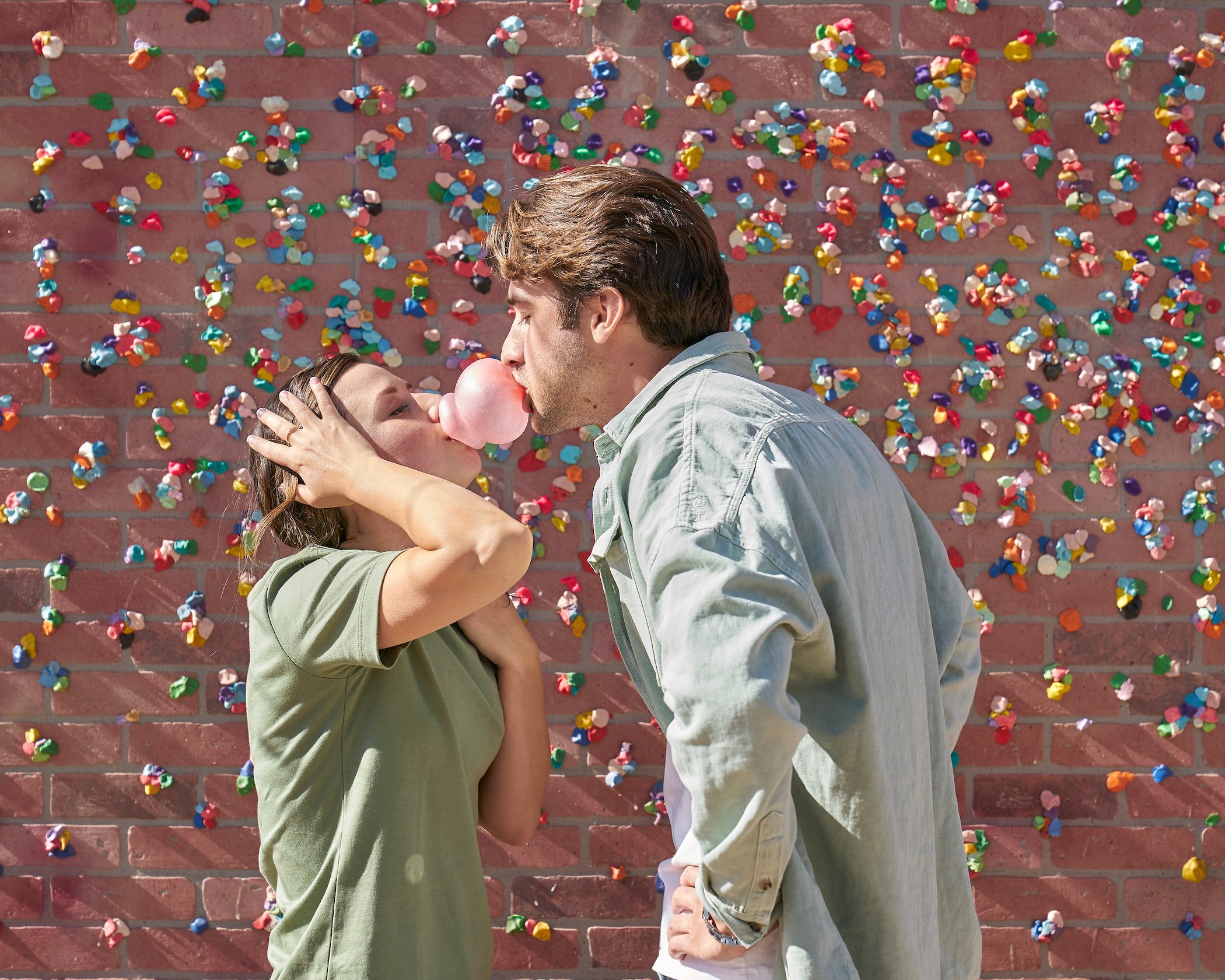 Greg Grippo and Katie Thurston blowing bubbles with bubble gum into each other's mouths on 'The Bachelorette'