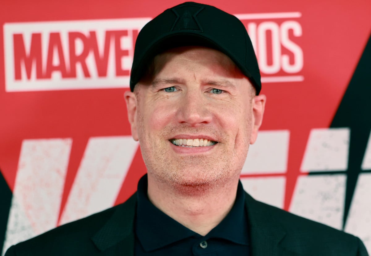 Kevin Feige in front of Marvel Studios banner.