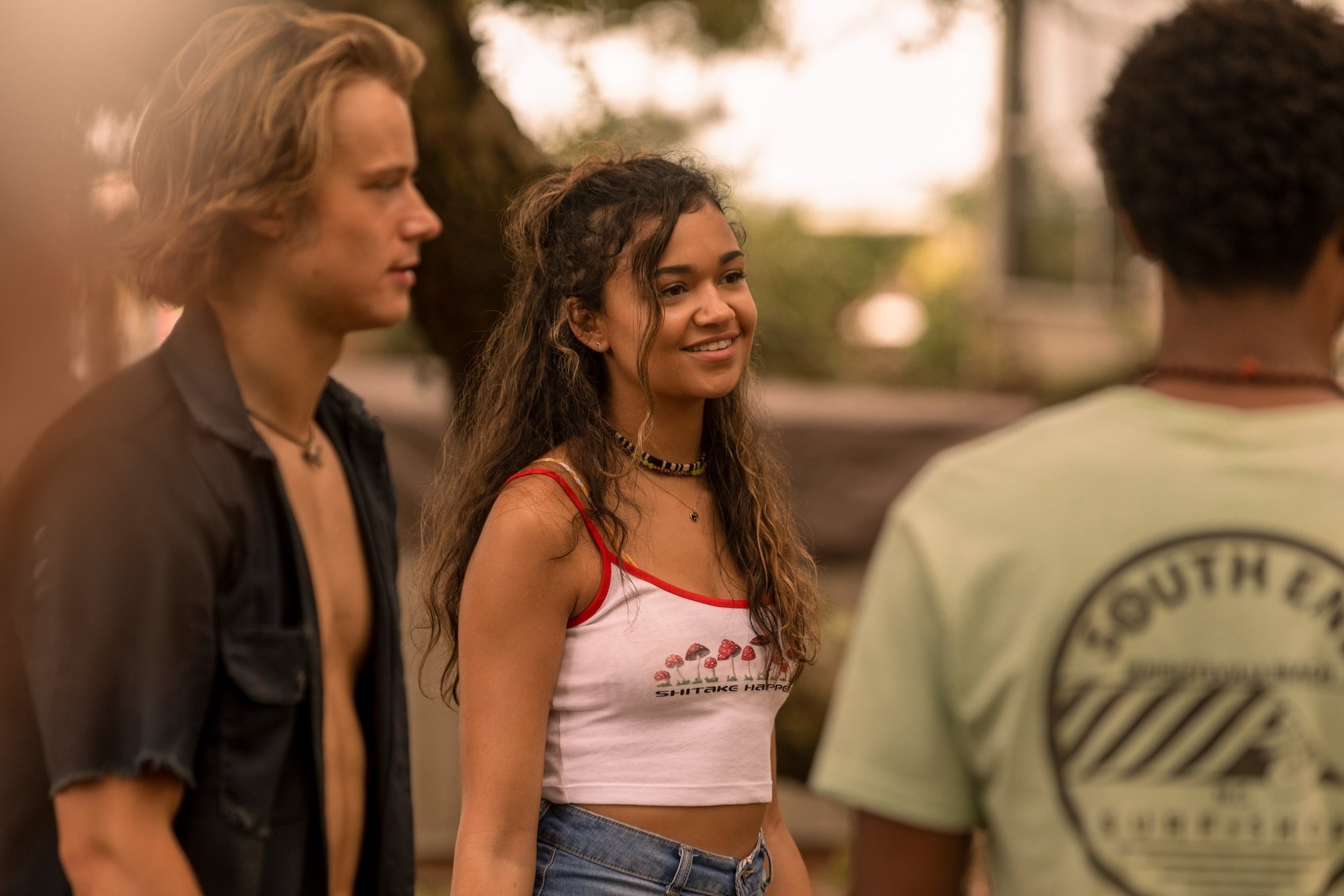 RUDY PANKOW as JJ, MADISON BAILEY as KIARA, and JONATHAN DAVISS as POPE in 'Outer Banks' Season 2