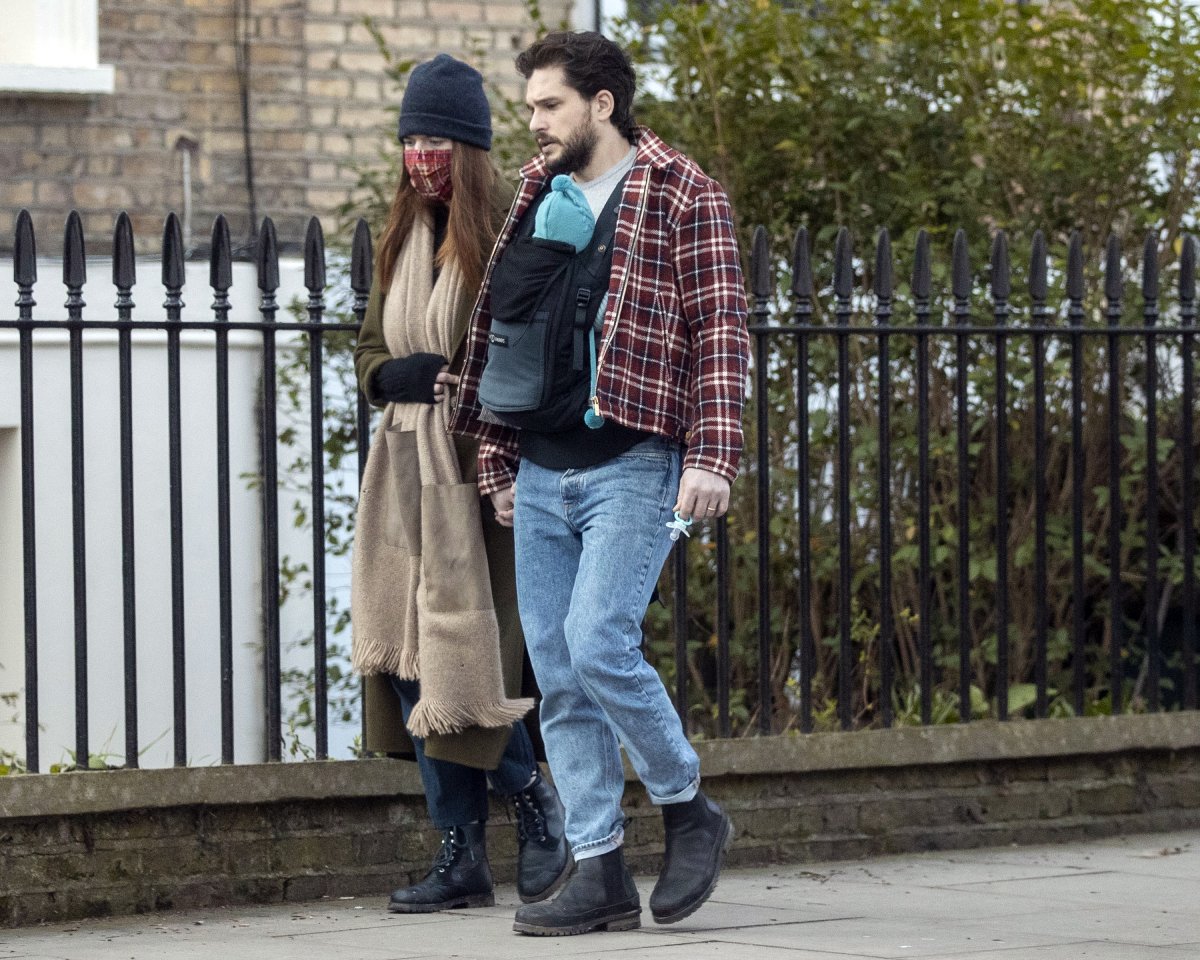 Kit Harington and Rose Leslie seen with their baby boy on a walk in North London on February 24, 2021 in London, England