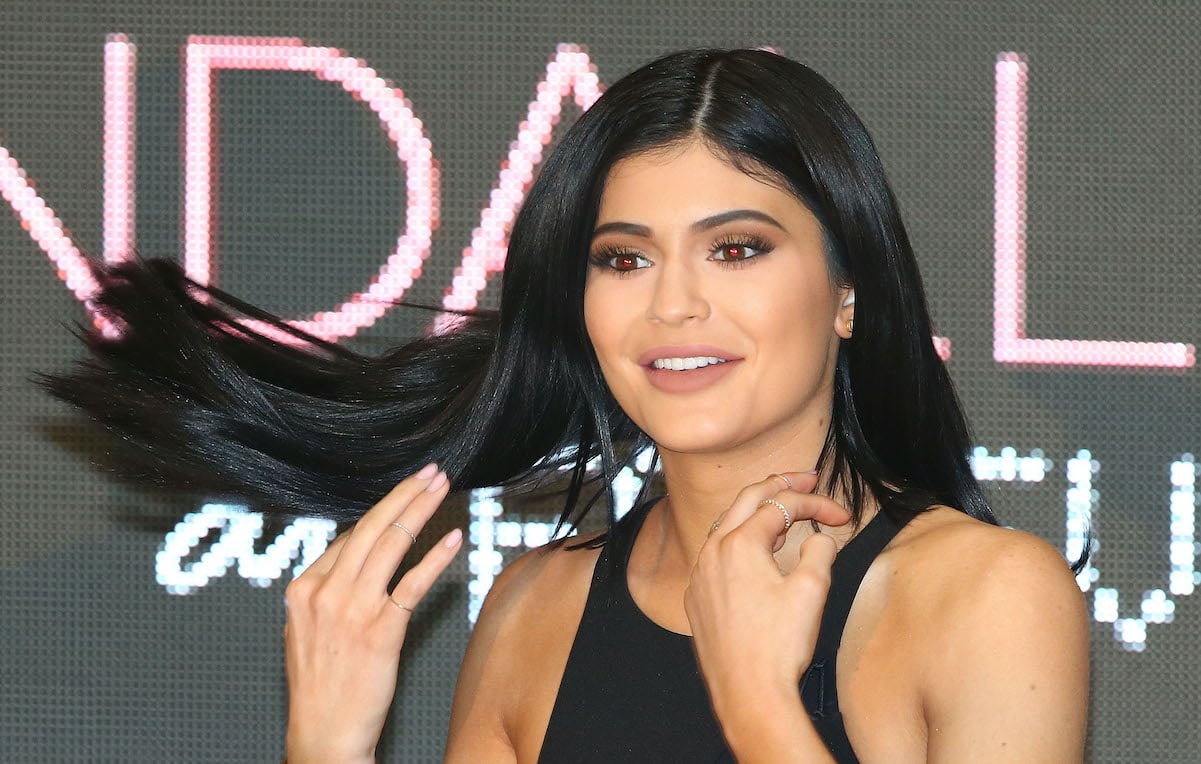 Kylie Jenner flipping her hair and smiling