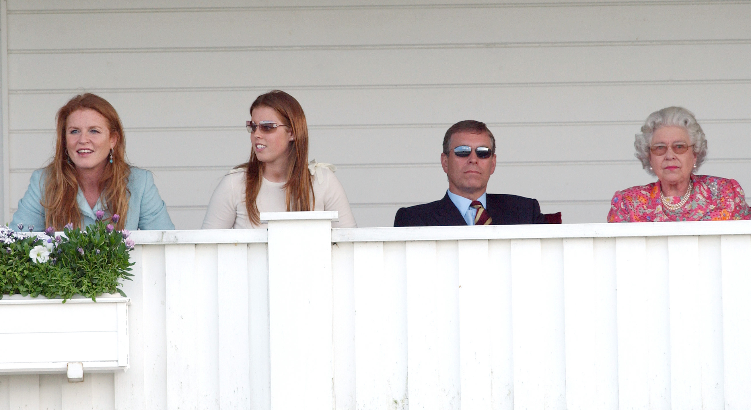 (L to R) Sarah Ferguson, Princess Beatrice, Prince Andrew, and Queen Elizabeth II watching a polo match together