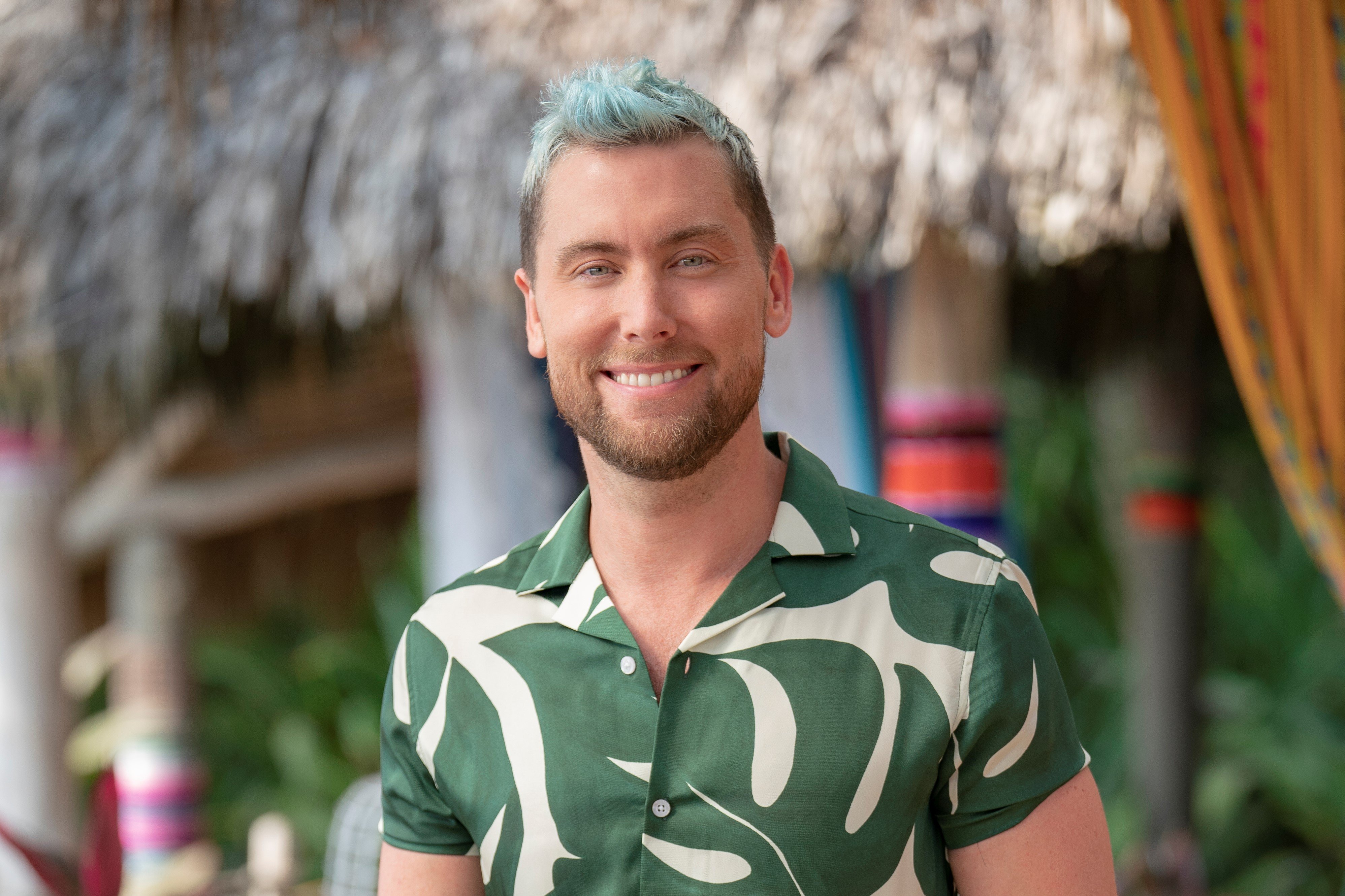 Lance Bass in a green and white patterned shirt.