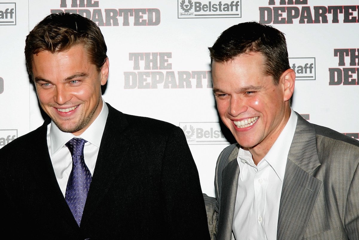 Leonardo DiCaprio and Matt Damon laugh on the red carpet of 'The Departed' in 2006