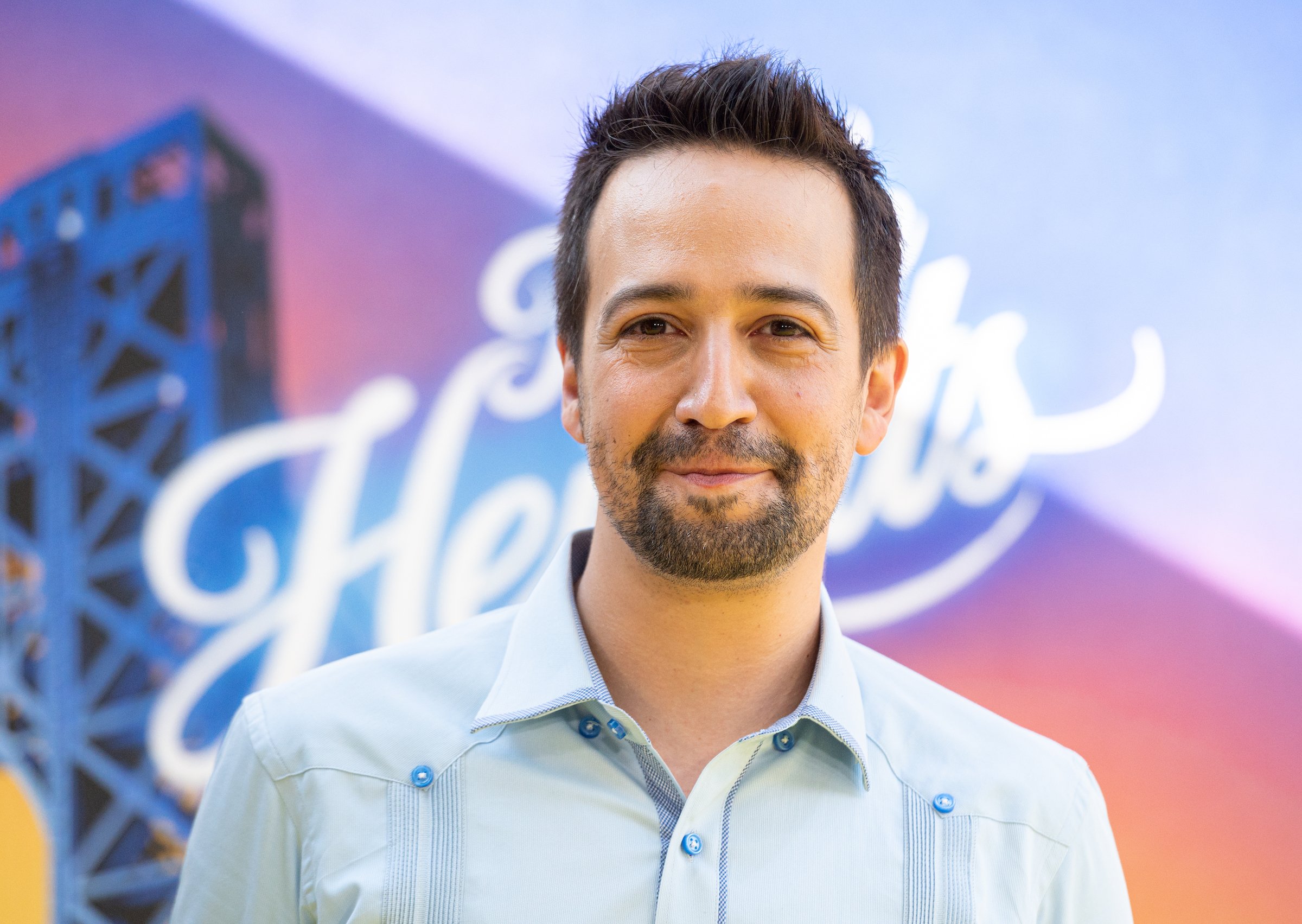 Lin Manuel Miranda smiling at In The Heights premiere