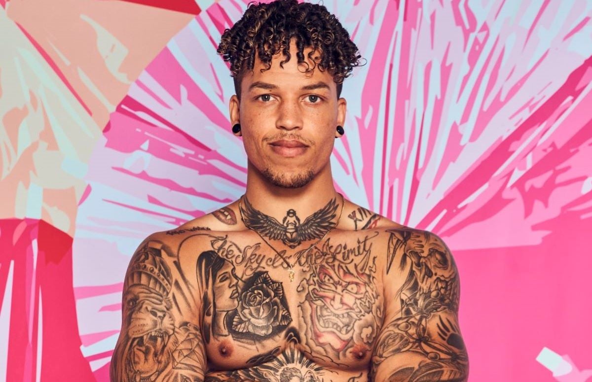 Korey Gandy of 'Love Island' poses shirtless and is covered with tattoos.