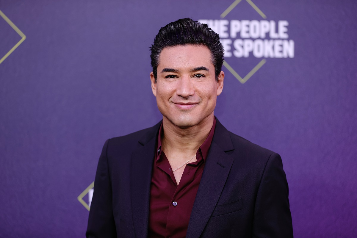 Actor Mario Lopez decked out in a black suit and burgundy shirt at the 2020 E!'s People's Choice Awards