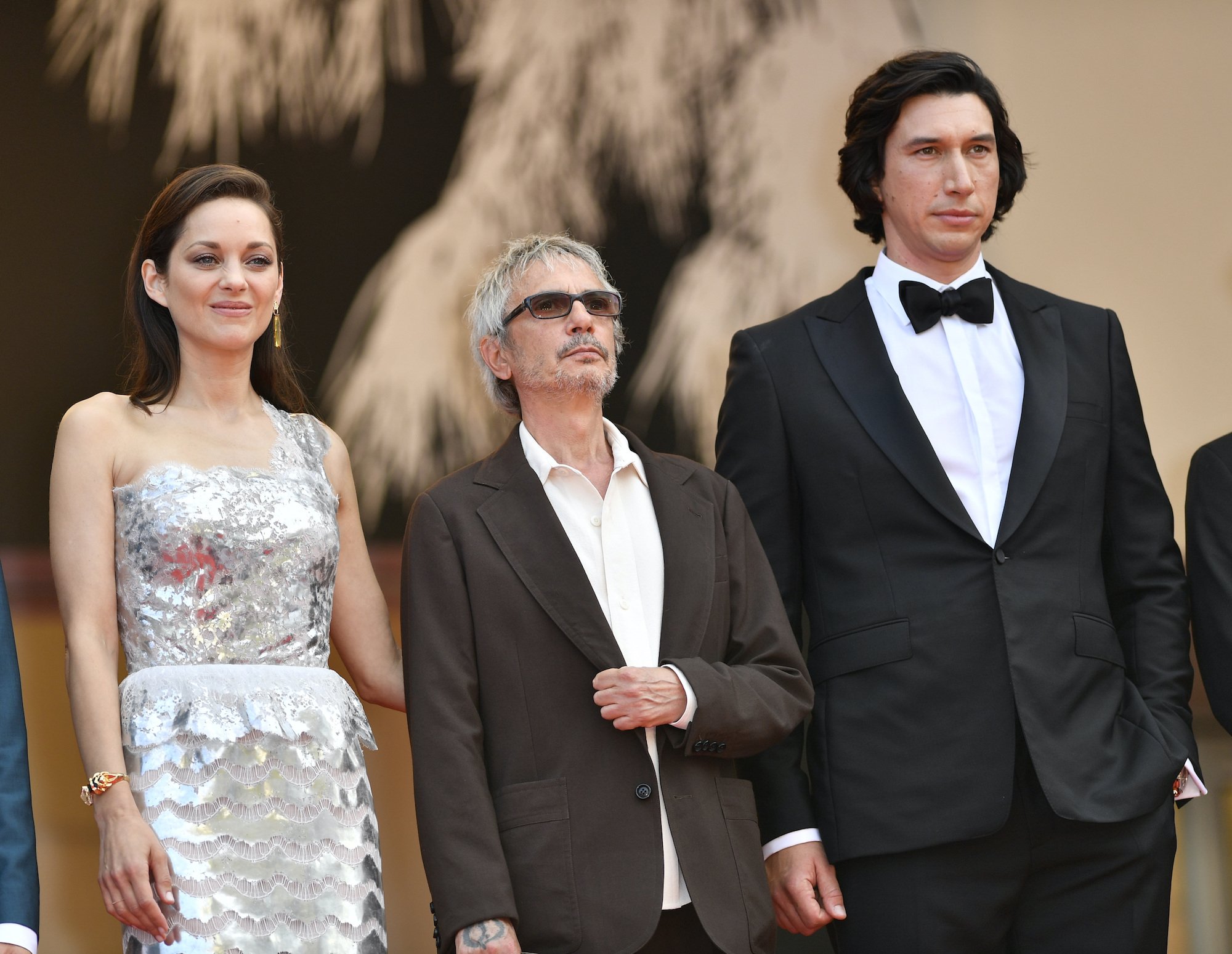 French actor Marion Cotillard, French film director Leos Carax, and US actor Adam Driver arrive for the screening of the film 'Annette' in competition and the Opening Ceremony of the 74th annual Cannes Film Festival