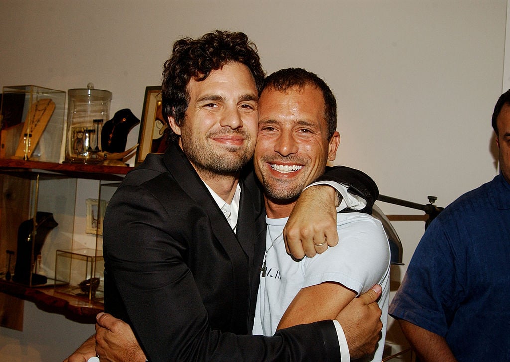 Mark Ruffalo and brother Scott  are all smiles as they hug each other, facing the camera.
