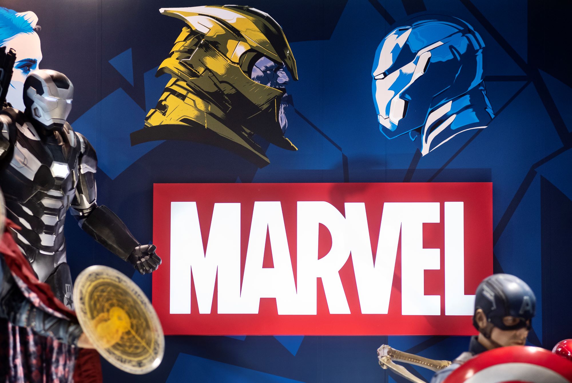 Marvel logo surrounded by representations of characters, such as Iron Man.