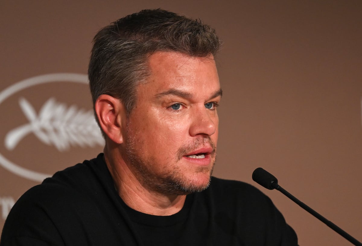 Matt Damon speaks into a microphone