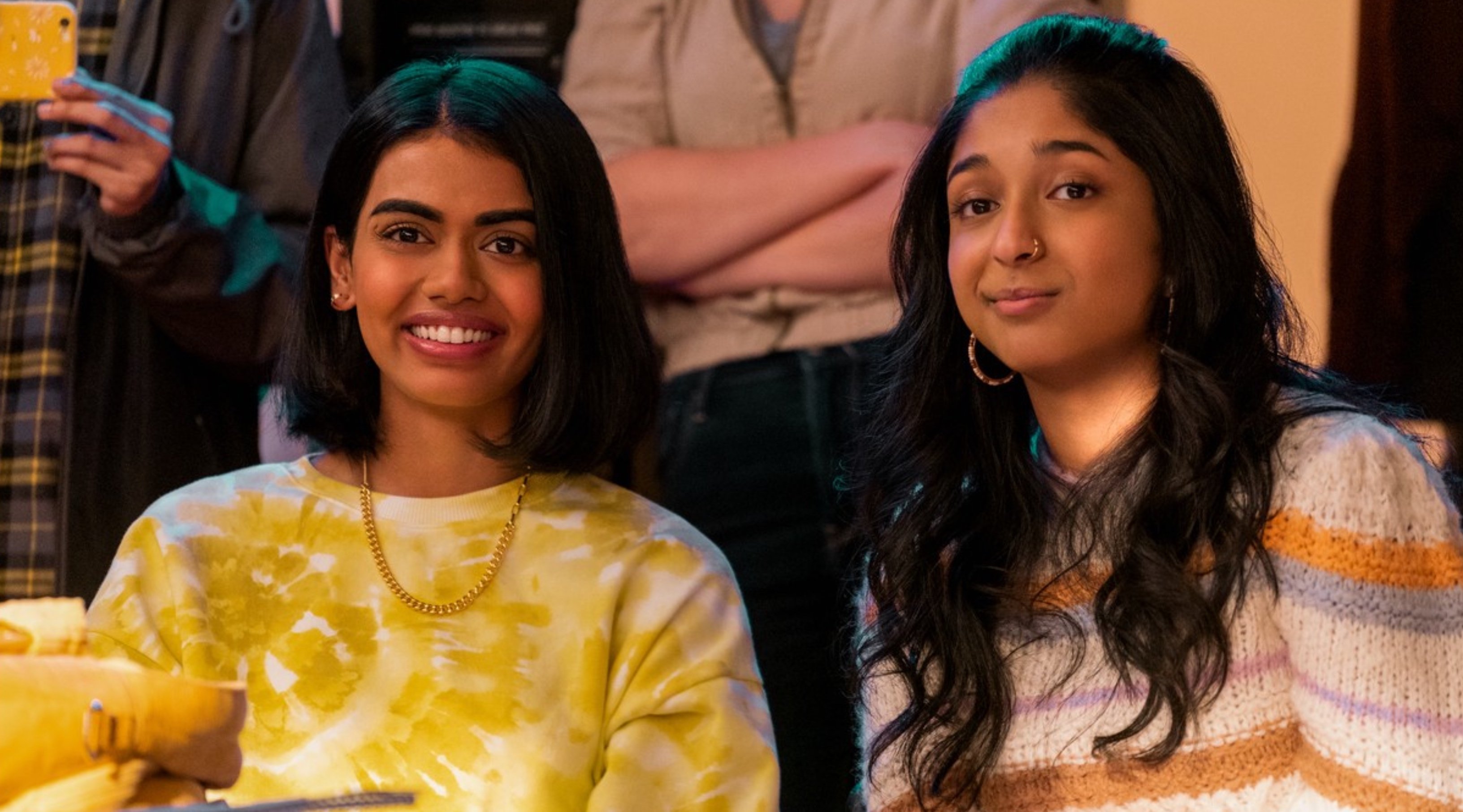 Megan Suri as Aneesa in 'Never Have I Ever' sitting next to Devi at school