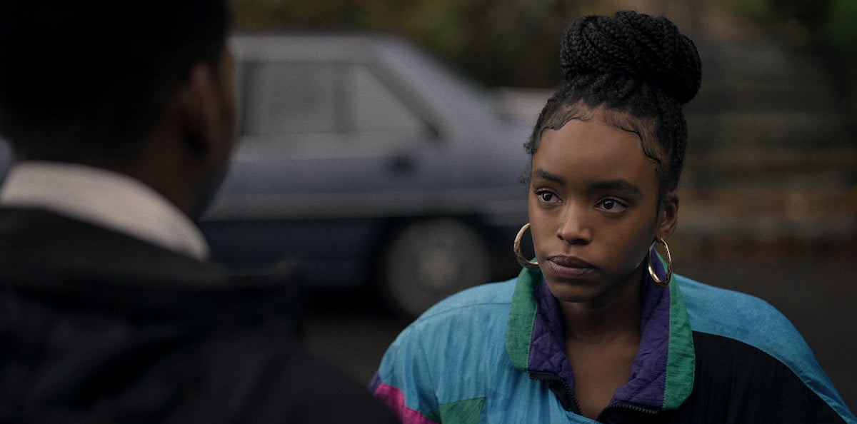 Lovie Simone as Davina Harrison starses at Mekai Curtis in 'Raising Kanan'