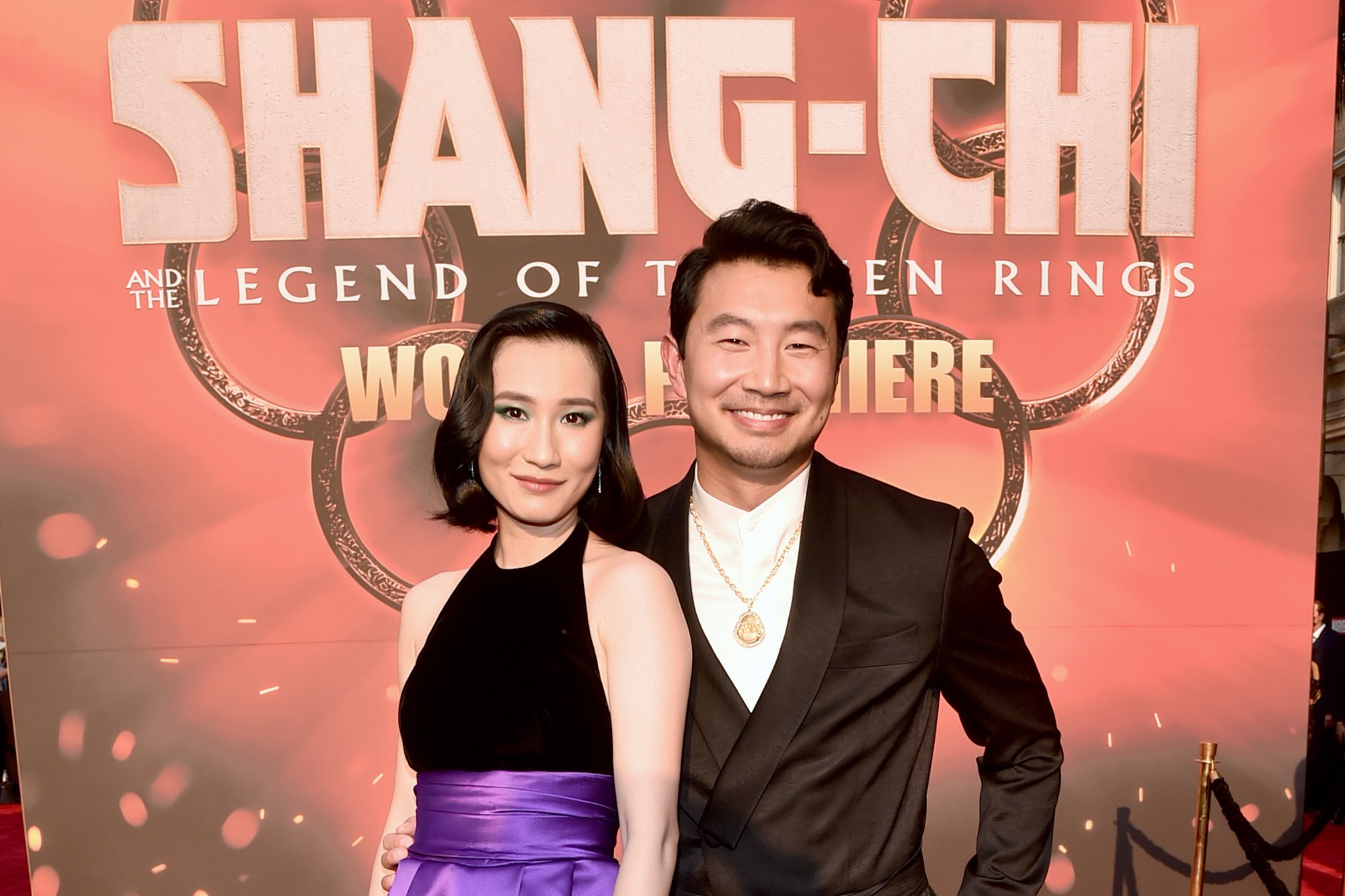 Meng'er Zhang and Simu Liu pose at 'Shang-Chi and the Legend of the Ten Rings' premiere