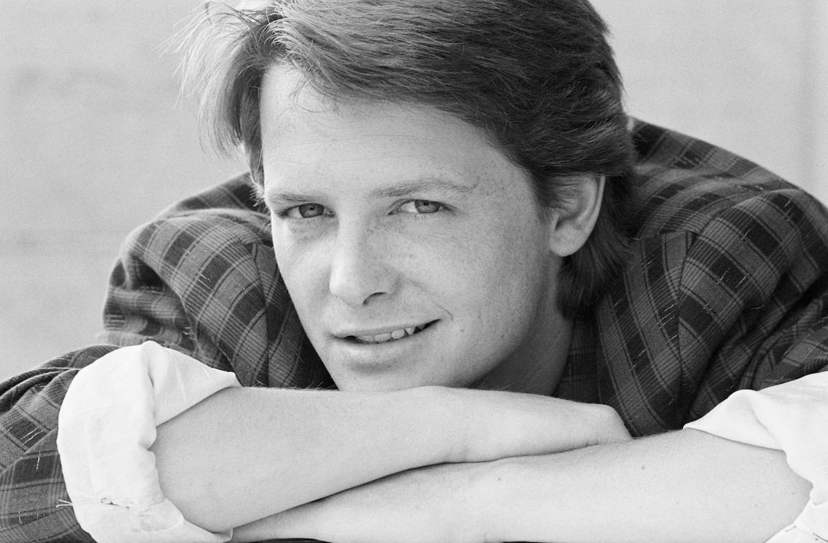 Michael J. Fox in a black and white photo looking at the camera