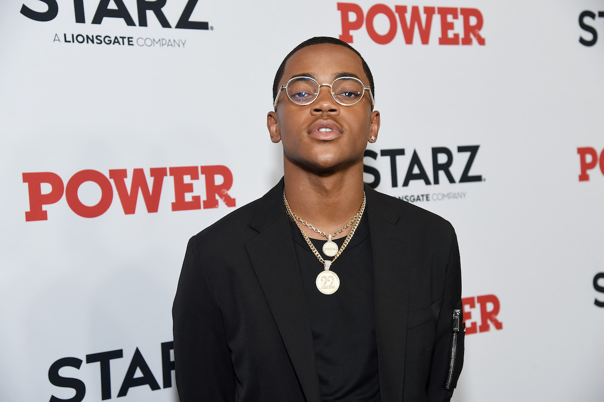 Michael Rainey Jr on red carpet in black shirt with glasses