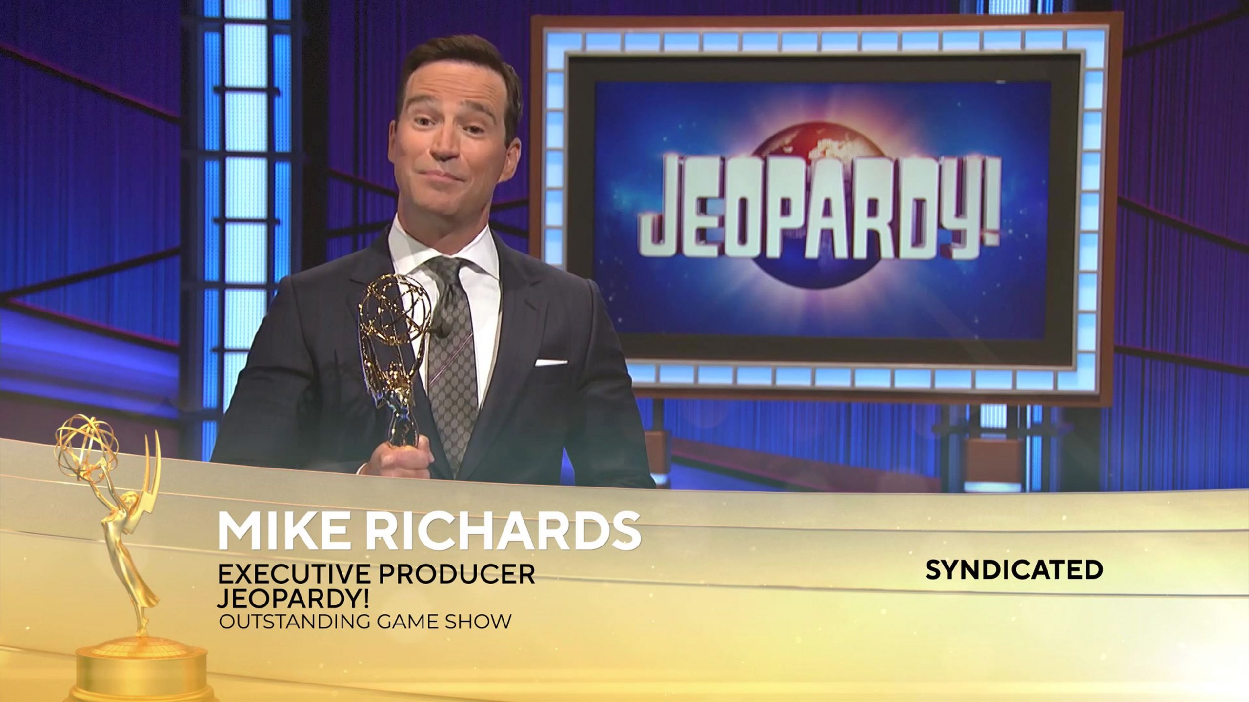 'Jeopardy!' executive producer Mike Richards accepts a 2021 Emmy for the game show.