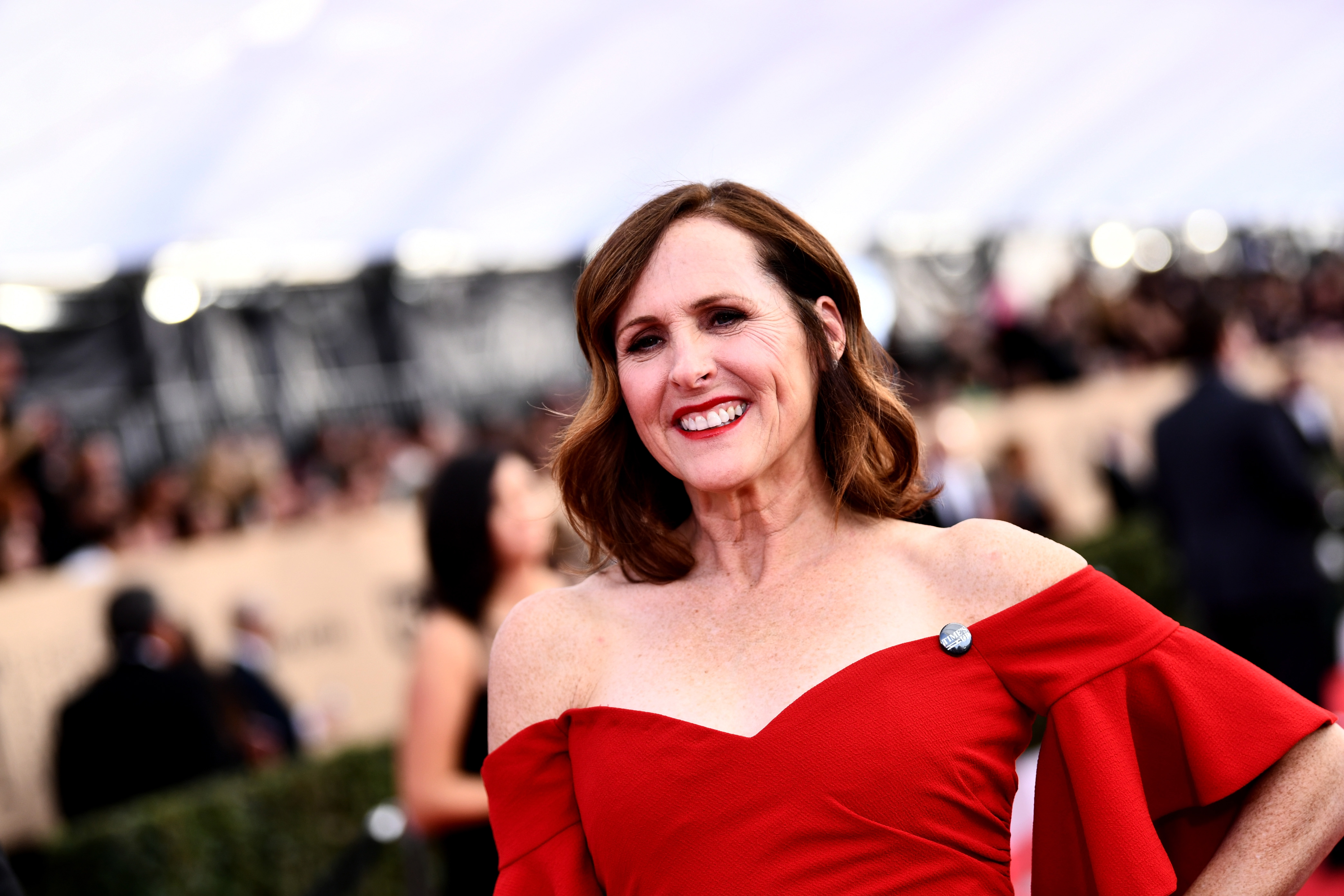 Molly Shannon in a red dress.