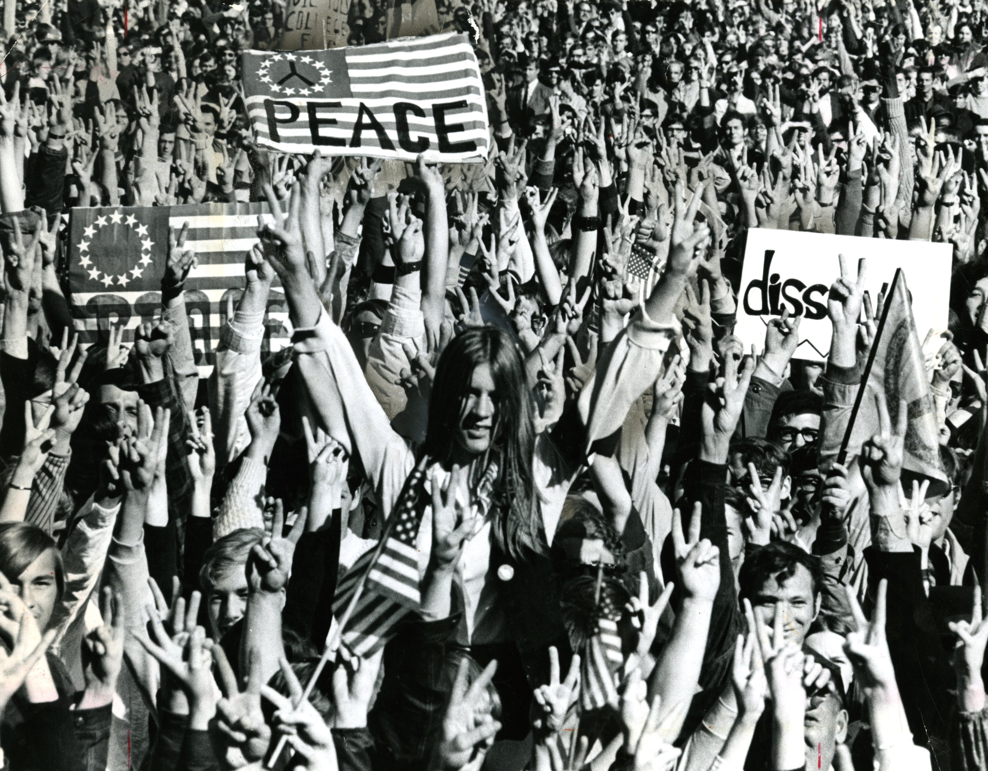 People making peace signs at the Moratorium March