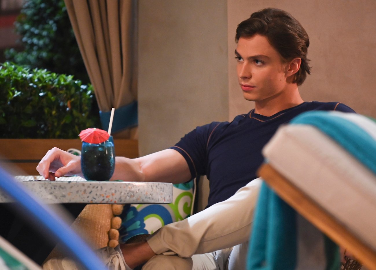 Nicholas Chavez in a navy blue shirt during a scene on 'General Hospital'