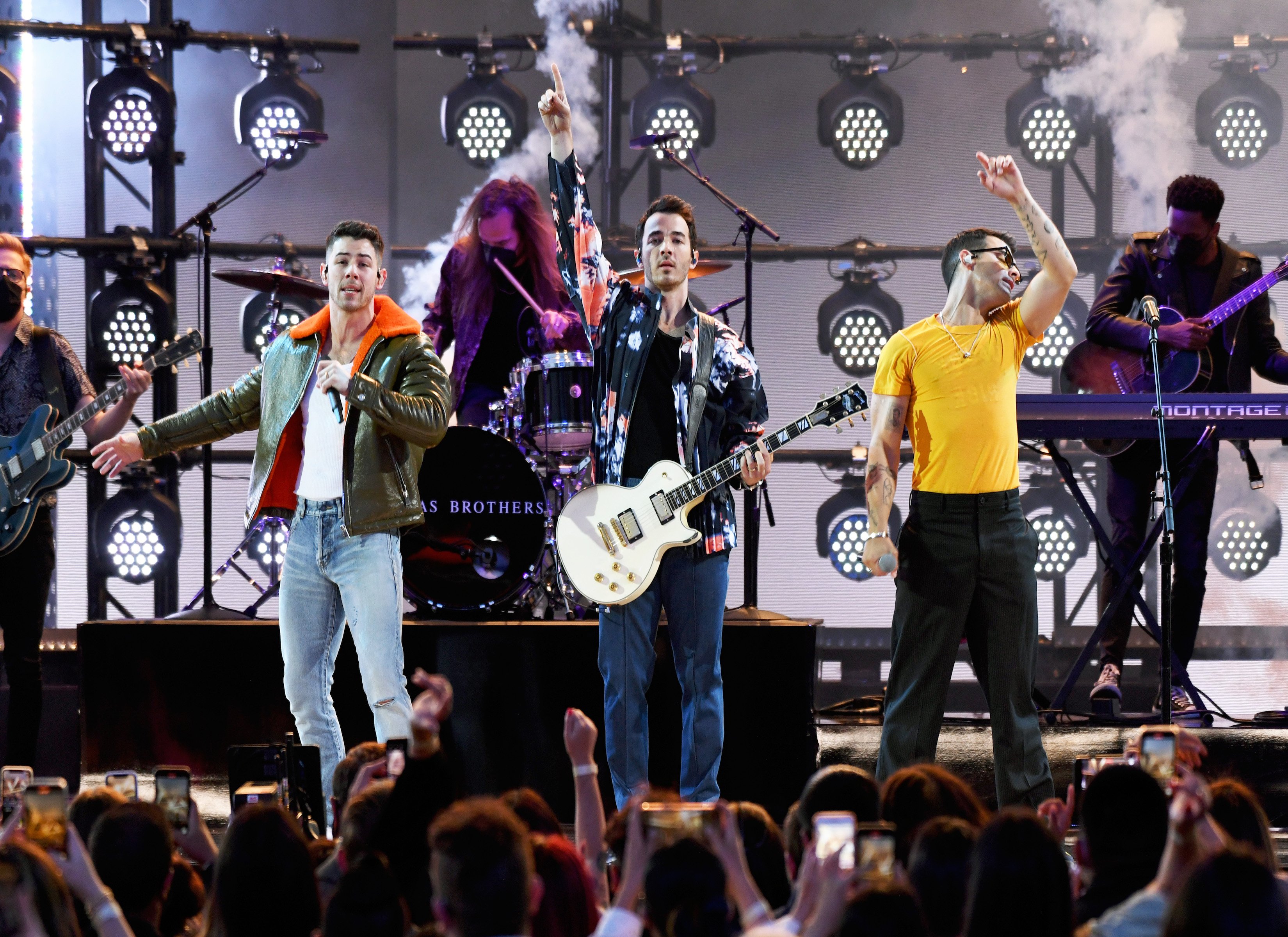 The Jonas Brothers performing onstage for the 2021 Billboard Music Awards