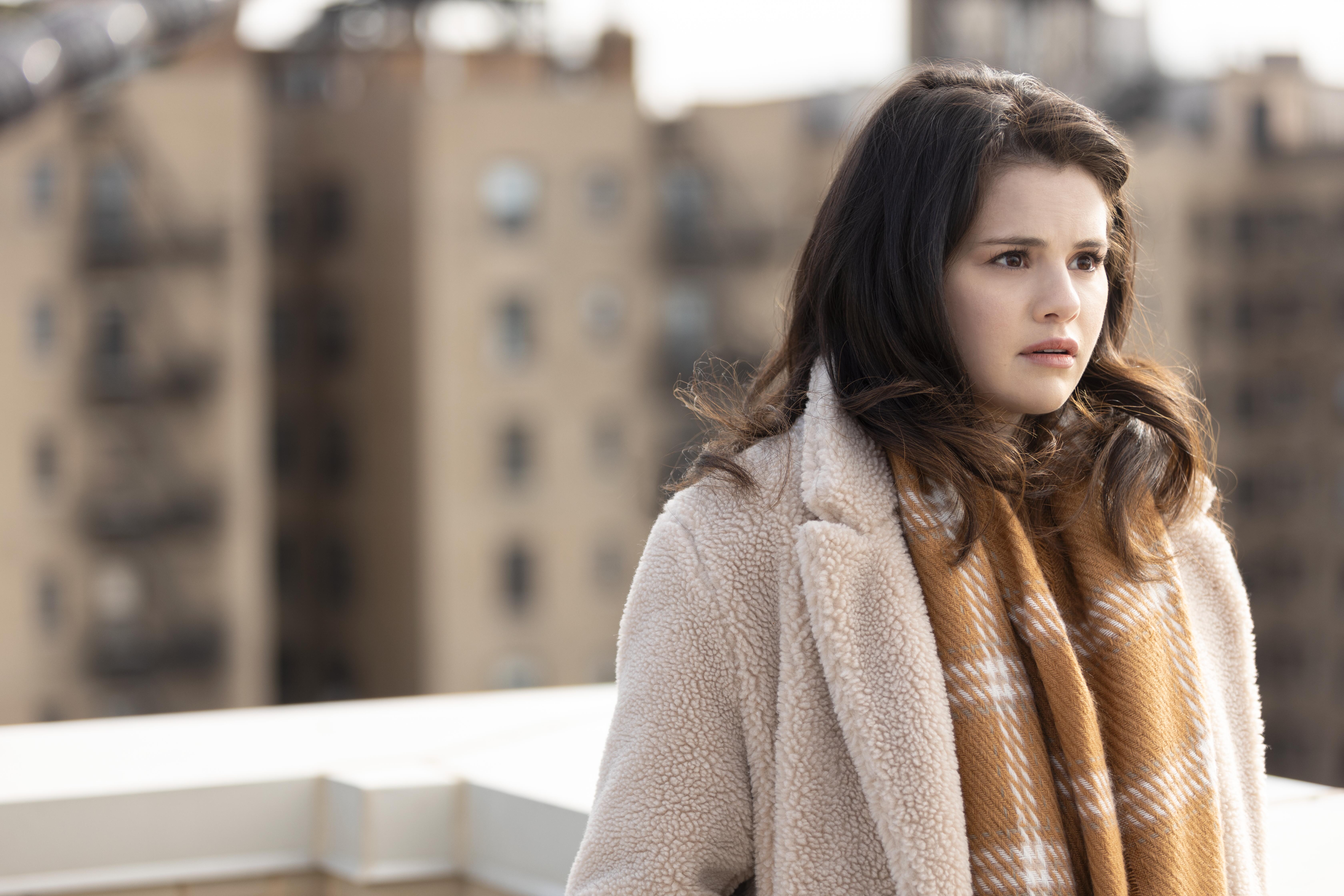 Selena Gomez wears a scarf on the roof