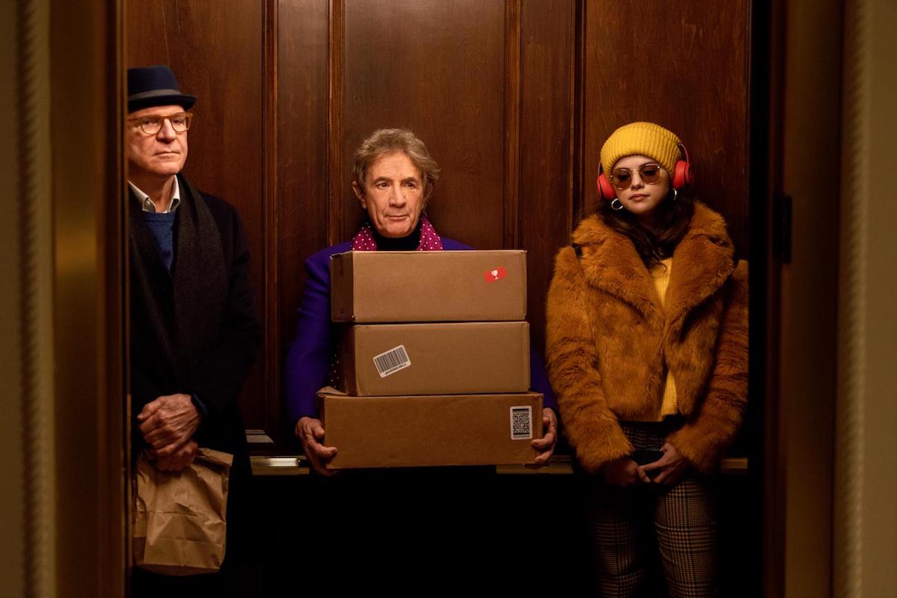 Charles, Oliver, and Mabel meeting in an elevator in 'Only Murders in the Building.'