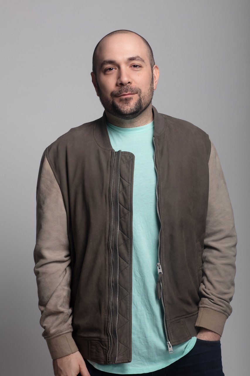 Hot 97 host Peter Rosenberg posing for a photo shoot.