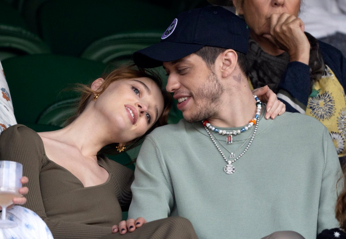 Phoebe Dynevor and Pete Davidson snuggle in the stands at Wimbledon.