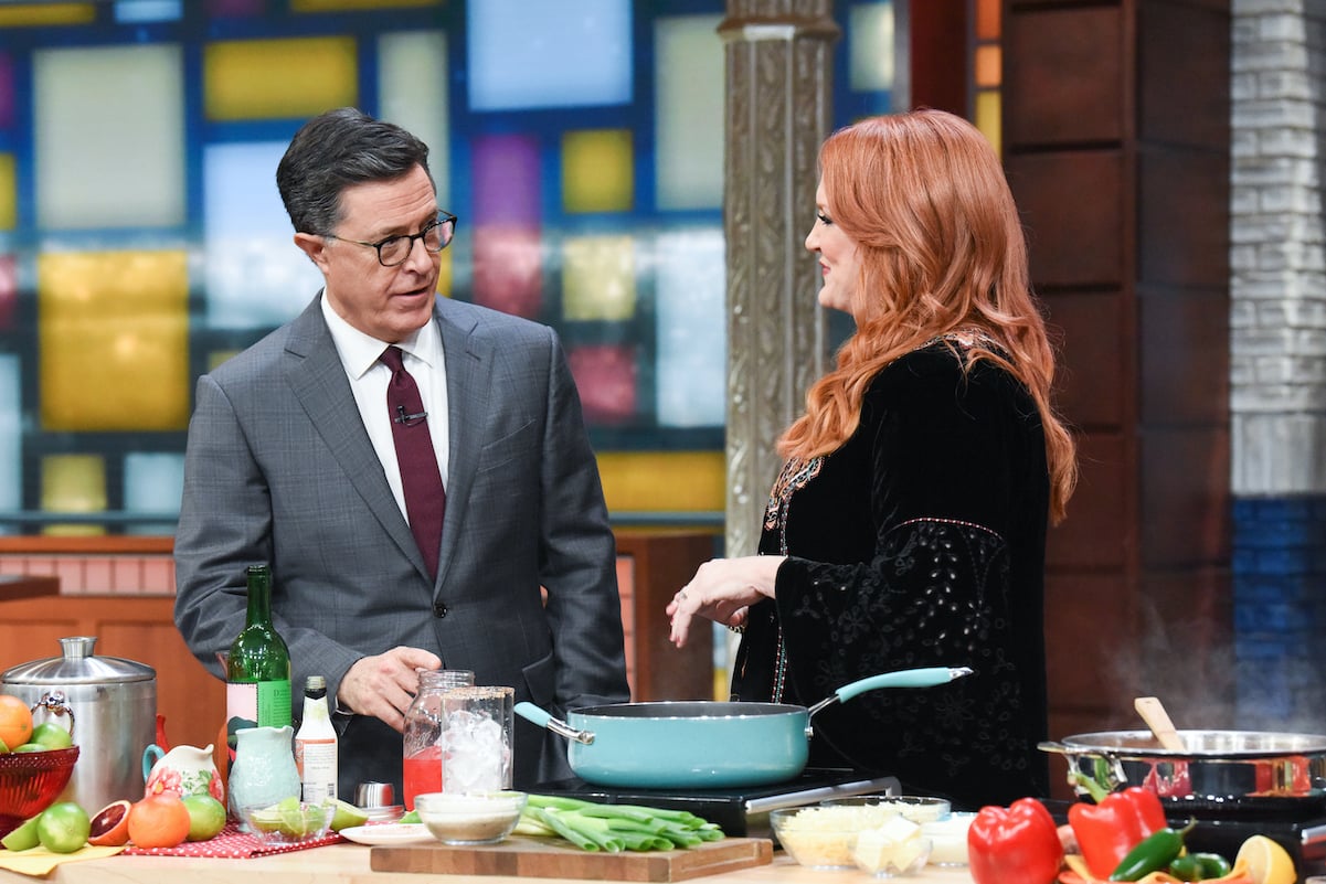 Ree Drummond smiles at Stephen Colbert while cooking