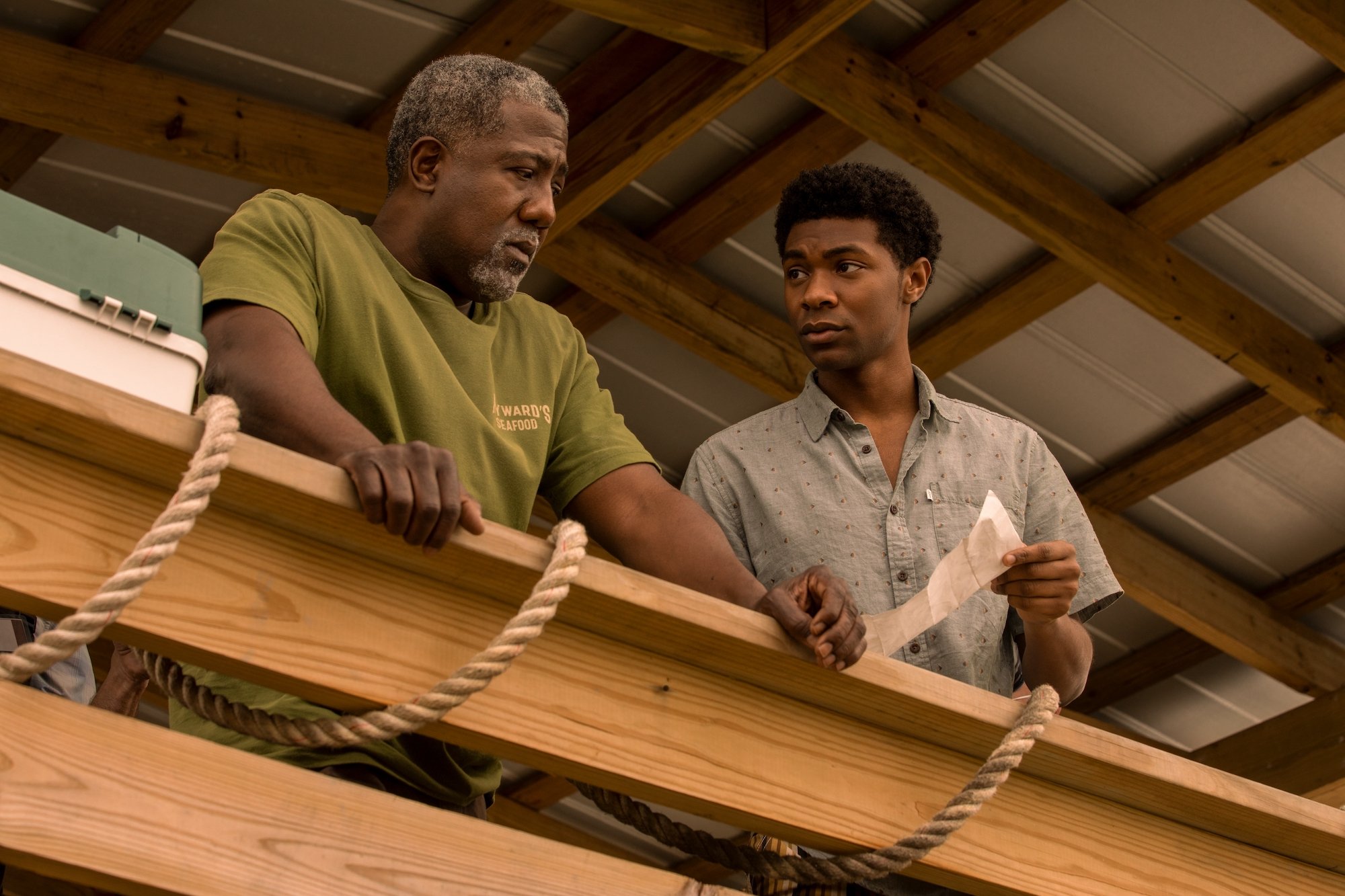 E. ROGER MITCHELL as HAYWARD and JONATHAN DAVISS as POPE in 'Outer Banks' Season 2