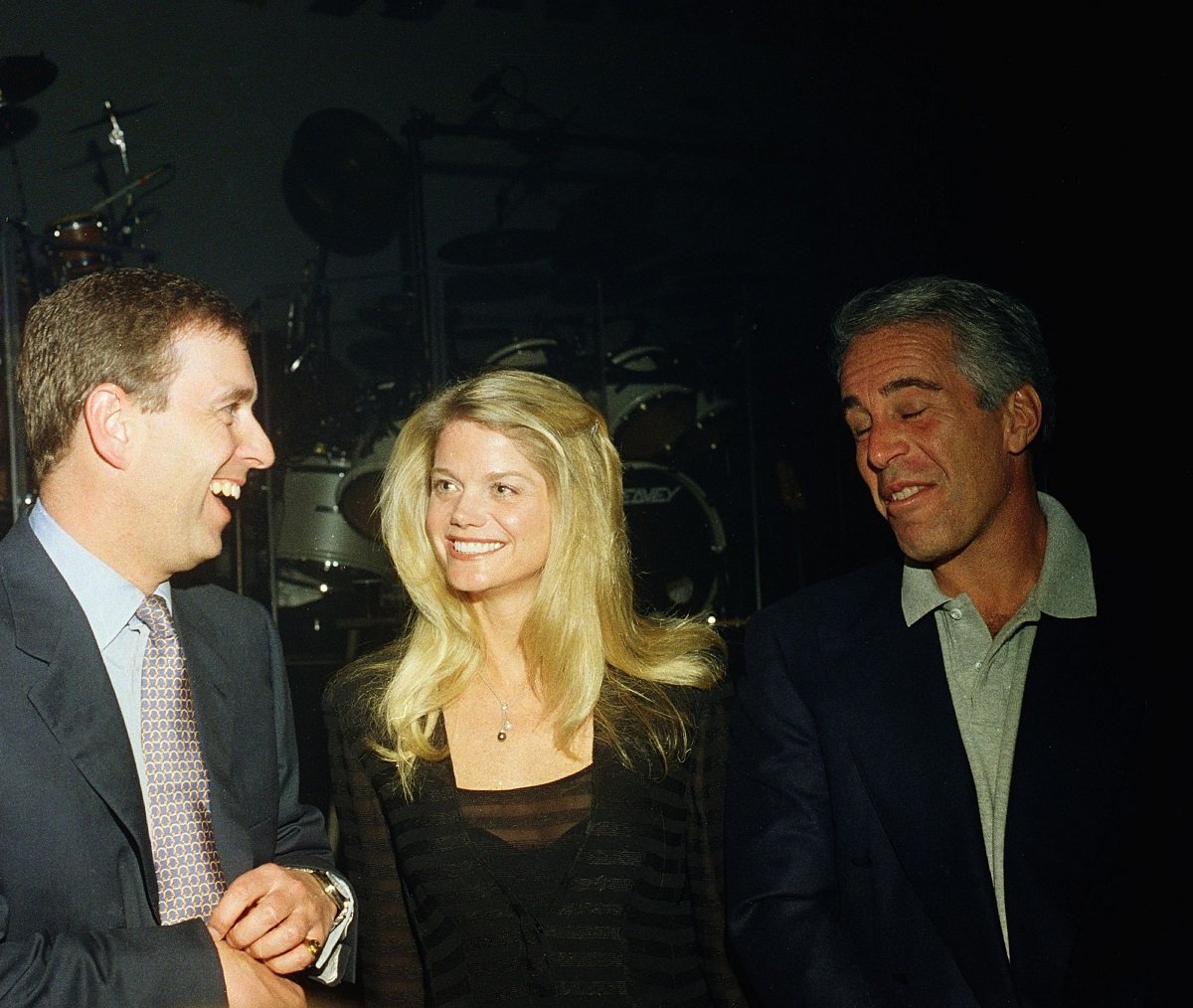 Prince Andrew, Gwendolyn Beck, and Jeffrey Epstein chatting and laughing during a party at the Mar-a-Lago club