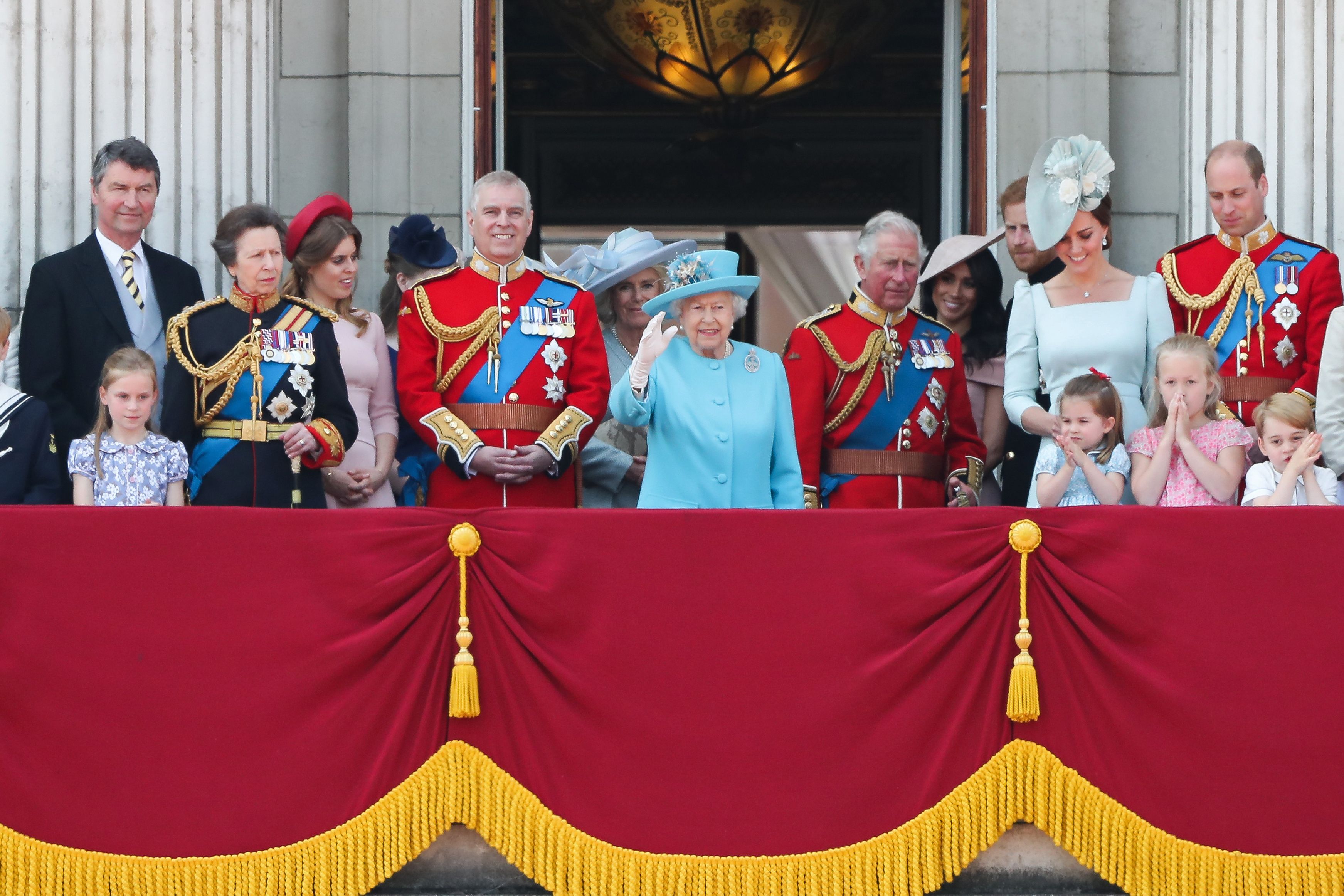 Prince Andrew, Queen Elizabeth II, and other members of the royal family standing on the balcony of Buckingham Palace