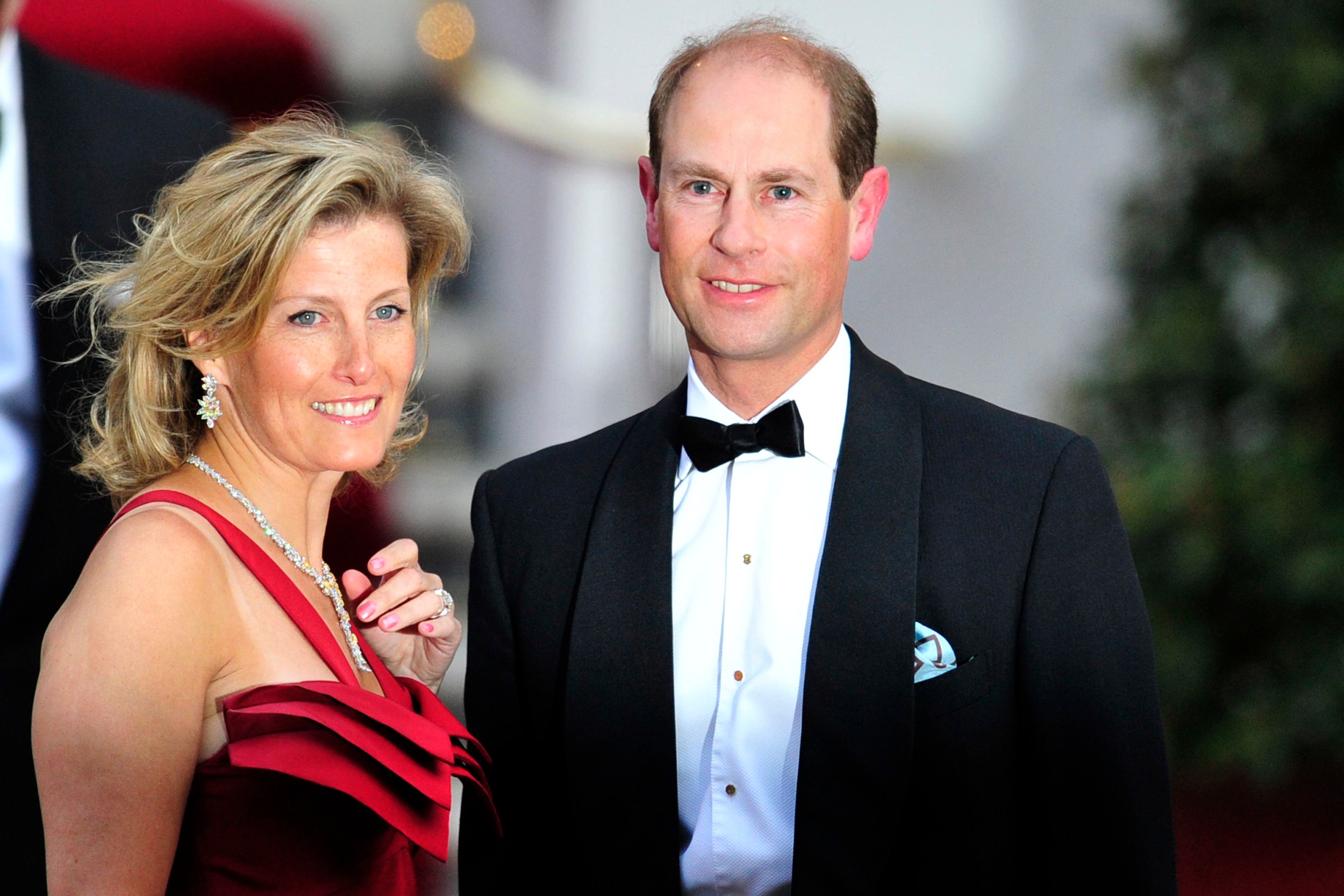 Prince Edward in a tuxedo and Sophie Wessex in a red gown at the Mandarin Oriental hotel for a gala dinner.