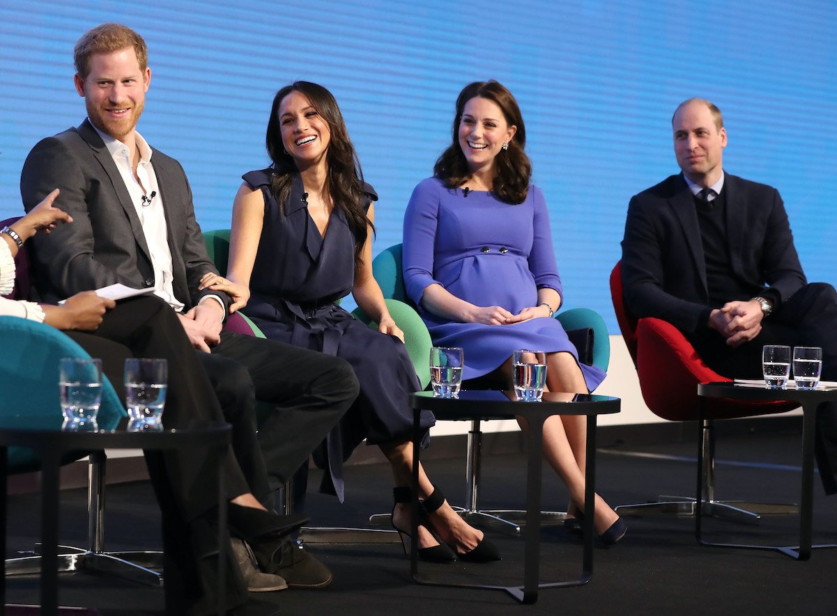 Prince Harry, Meghan Markle, Kate Middleton, and Prince William seated at the Royal Foundation Forum