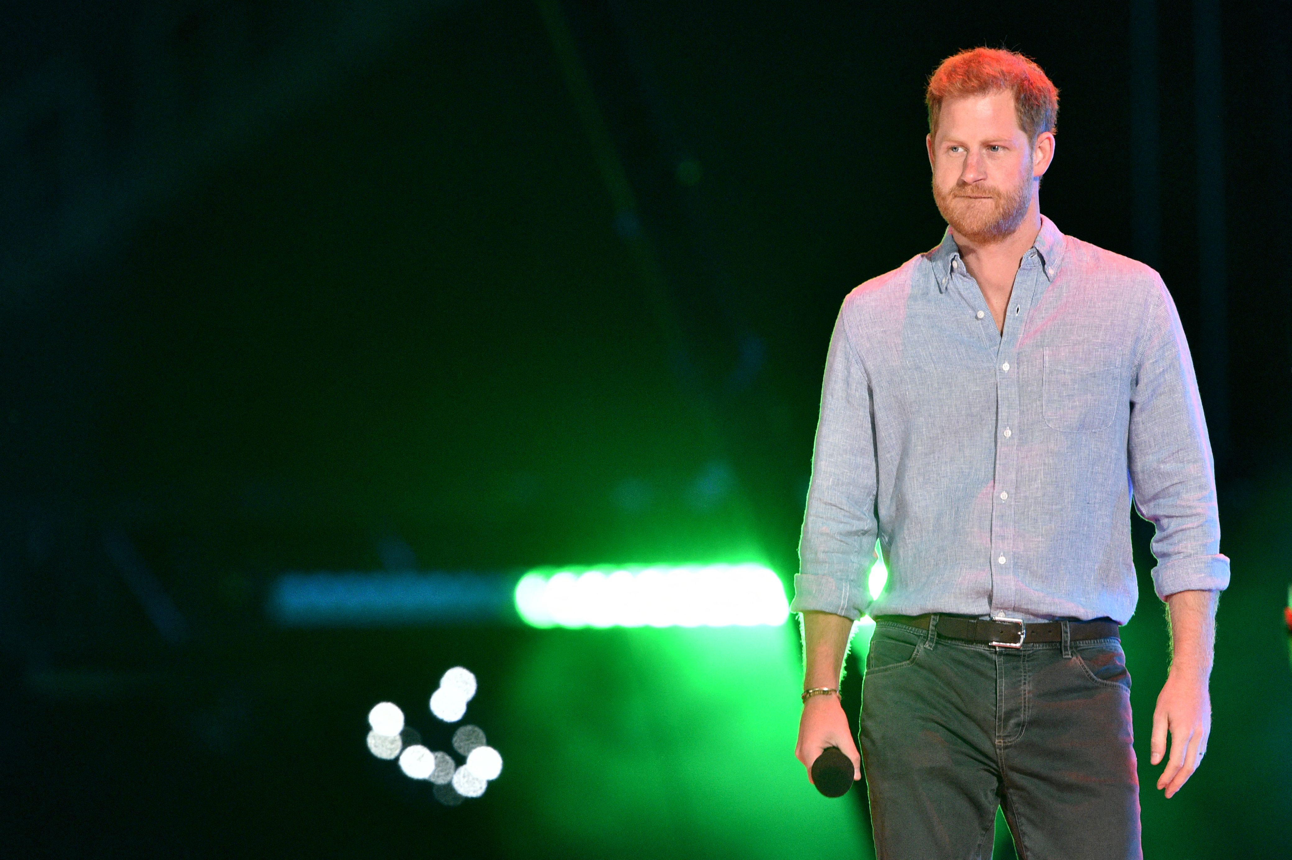 Prince Harry appearing onstage and dressed down at the Vax Live fundraising concert