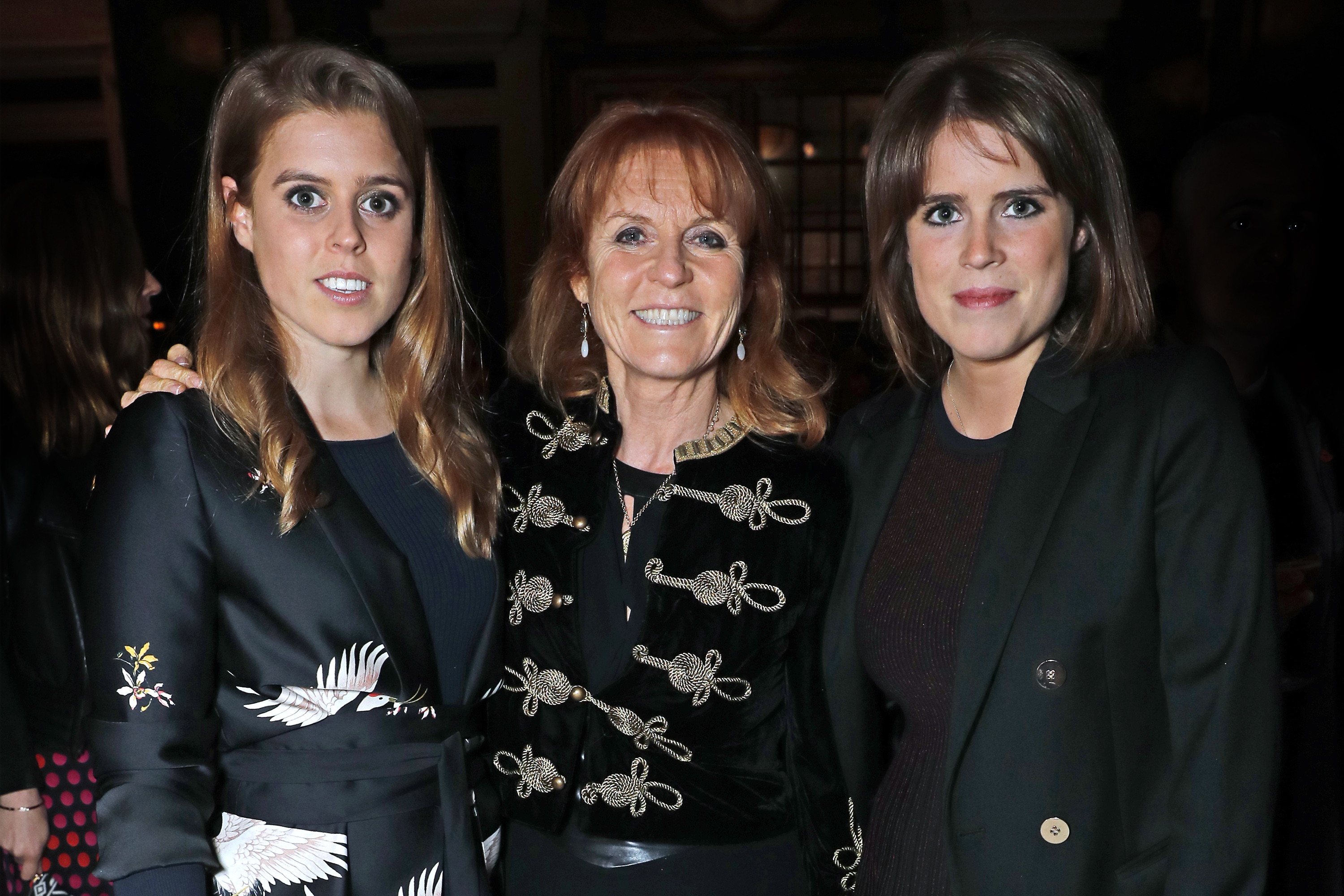 Princess Beatrice, Sarah Ferguson, and Princess Eugenie pose for a photo at an event in London