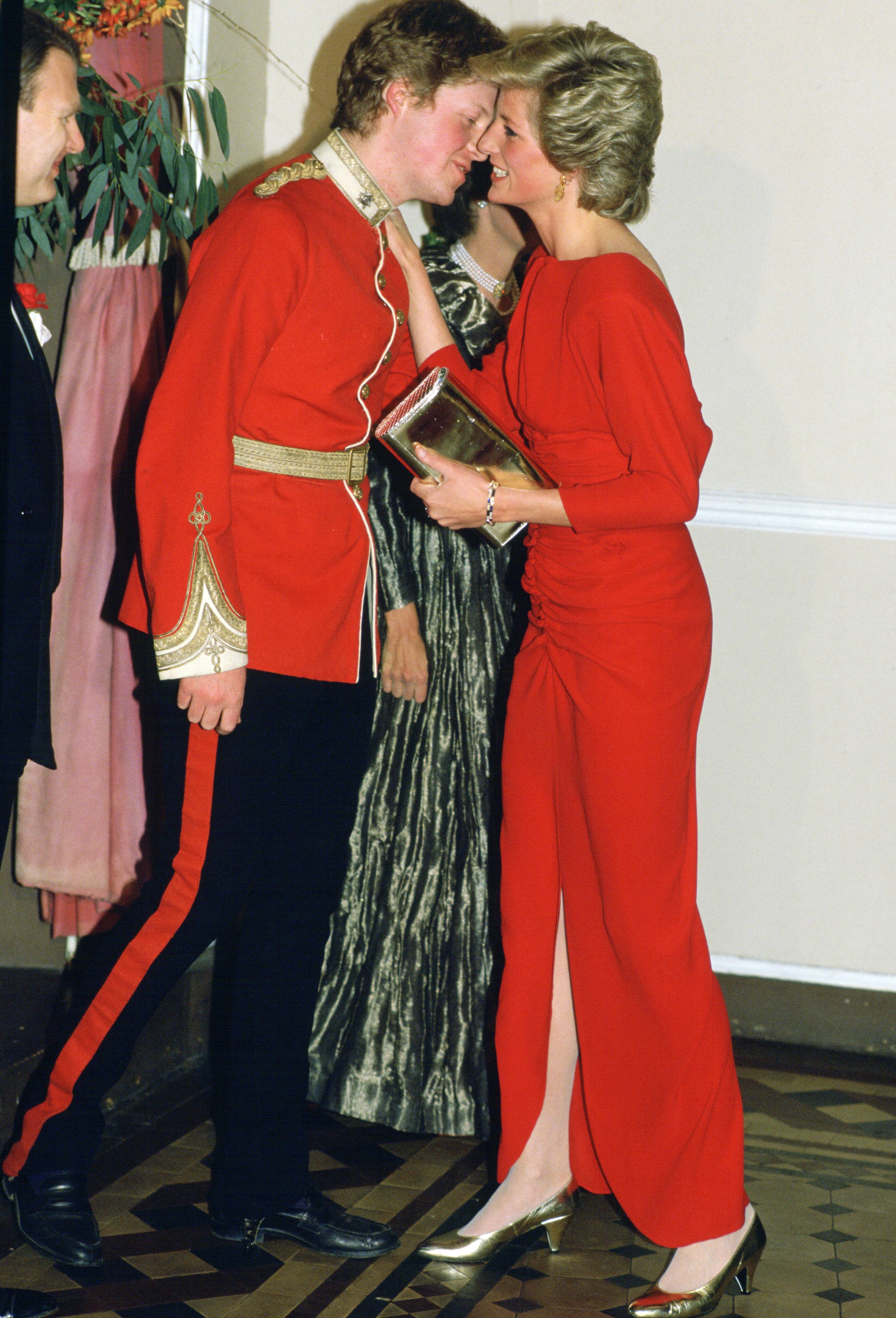 Princess Diana and her brother, Earl Charles Spencer, greet each other with a kiss on the cheek