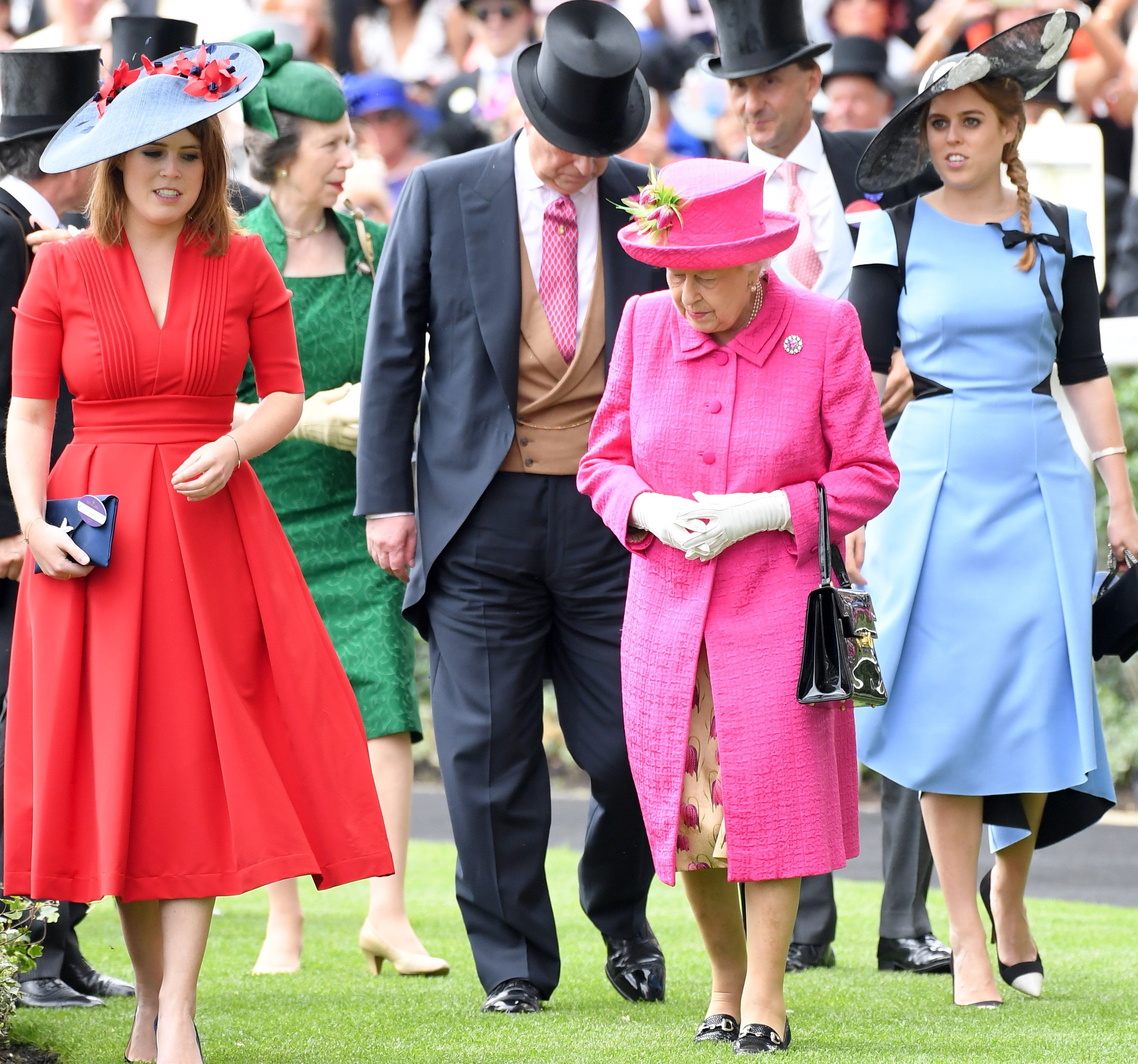 Princess Beatrice, Sarah Ferguson, and Princess Eugenie pose for a photo at an event in London