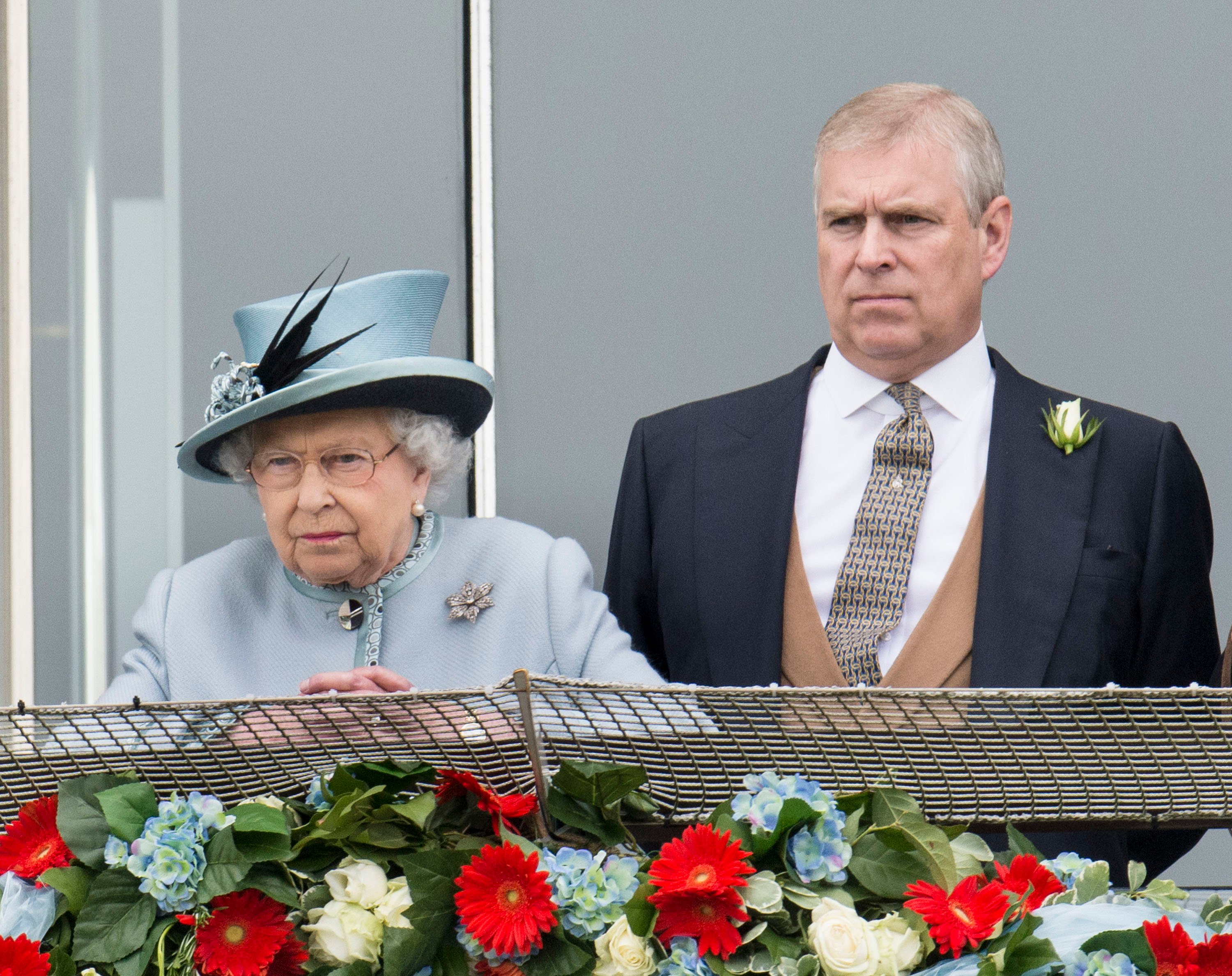 Queen Elizabeth II and Prince Andrew watching horses race at The Investec Derby Festival