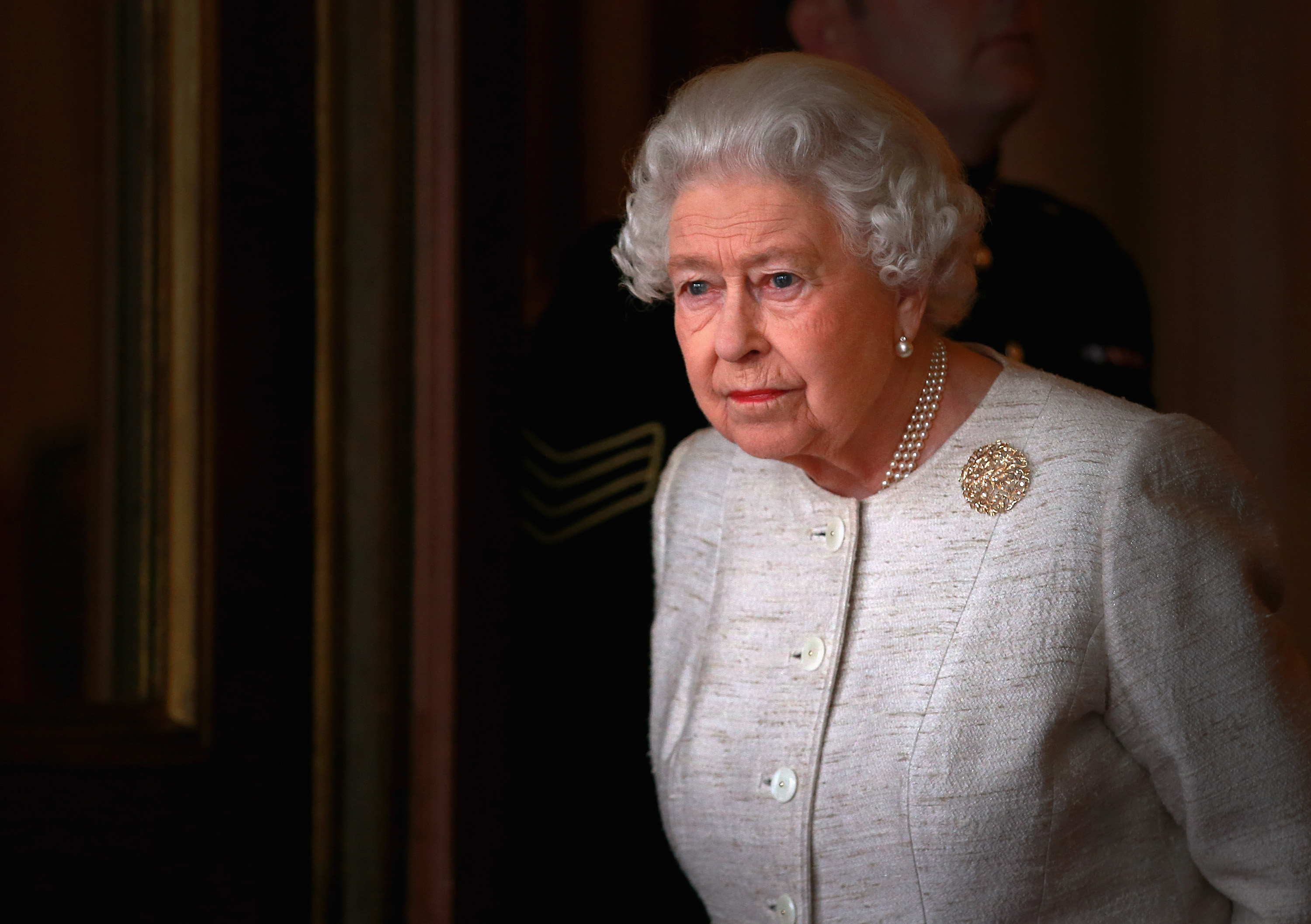 Queen Elizabeth II standing at Buckingham Palace as she prepares to greet Kazakhstan President