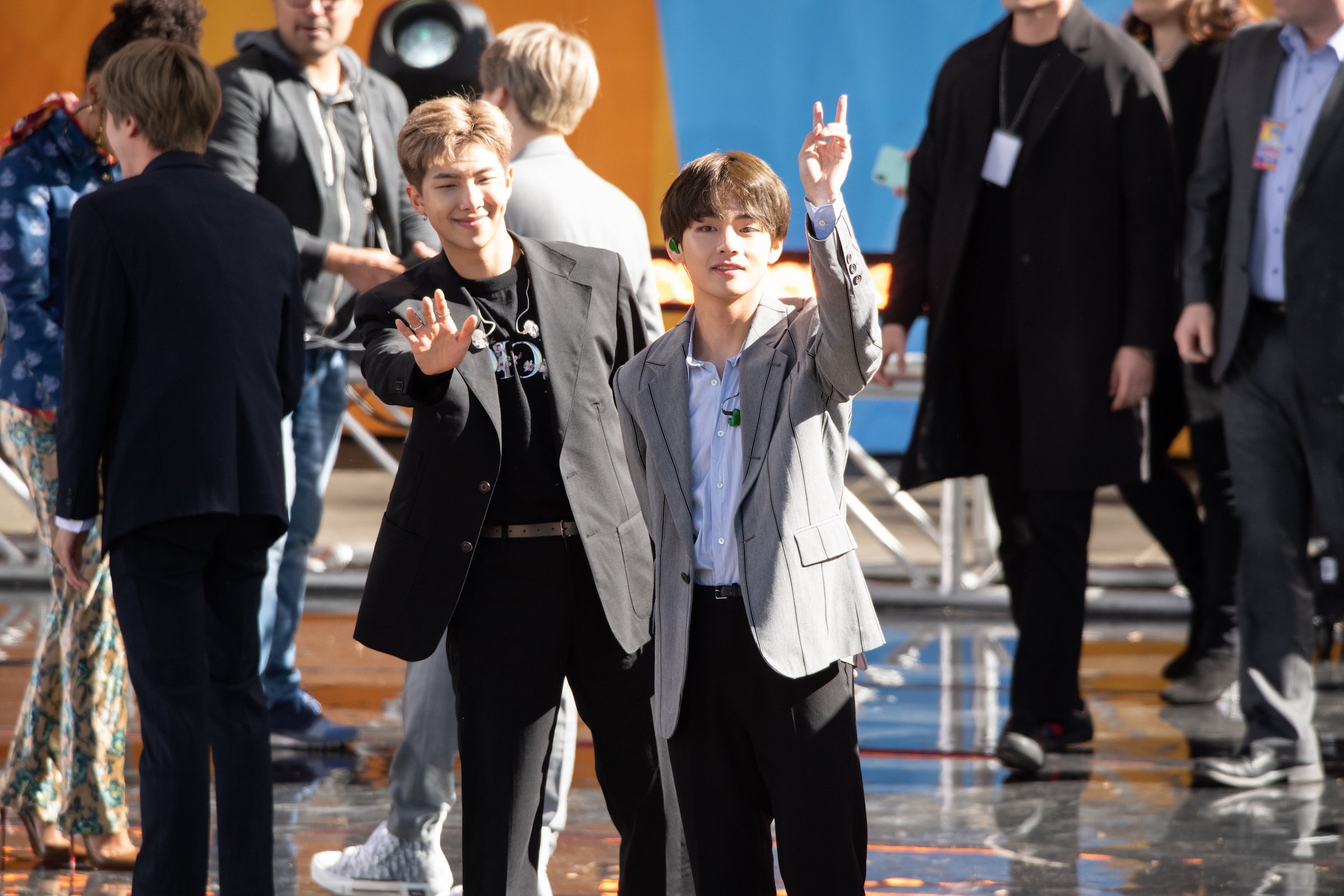Kim Taehyung and RM of BTS perform on 'Good Morning America' waving to fans