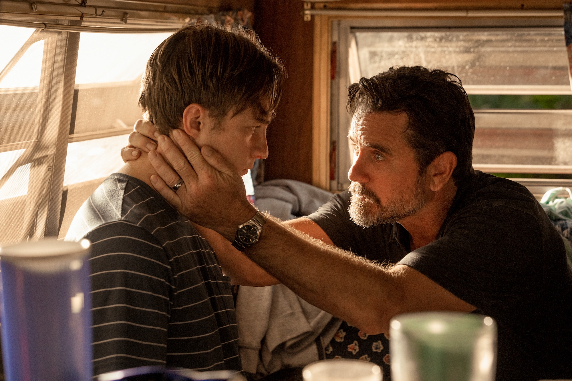 DREW STARKEY as RAFE and CHARLES ESTEN as WARD CAMERON in 'Outer Banks' Season 2