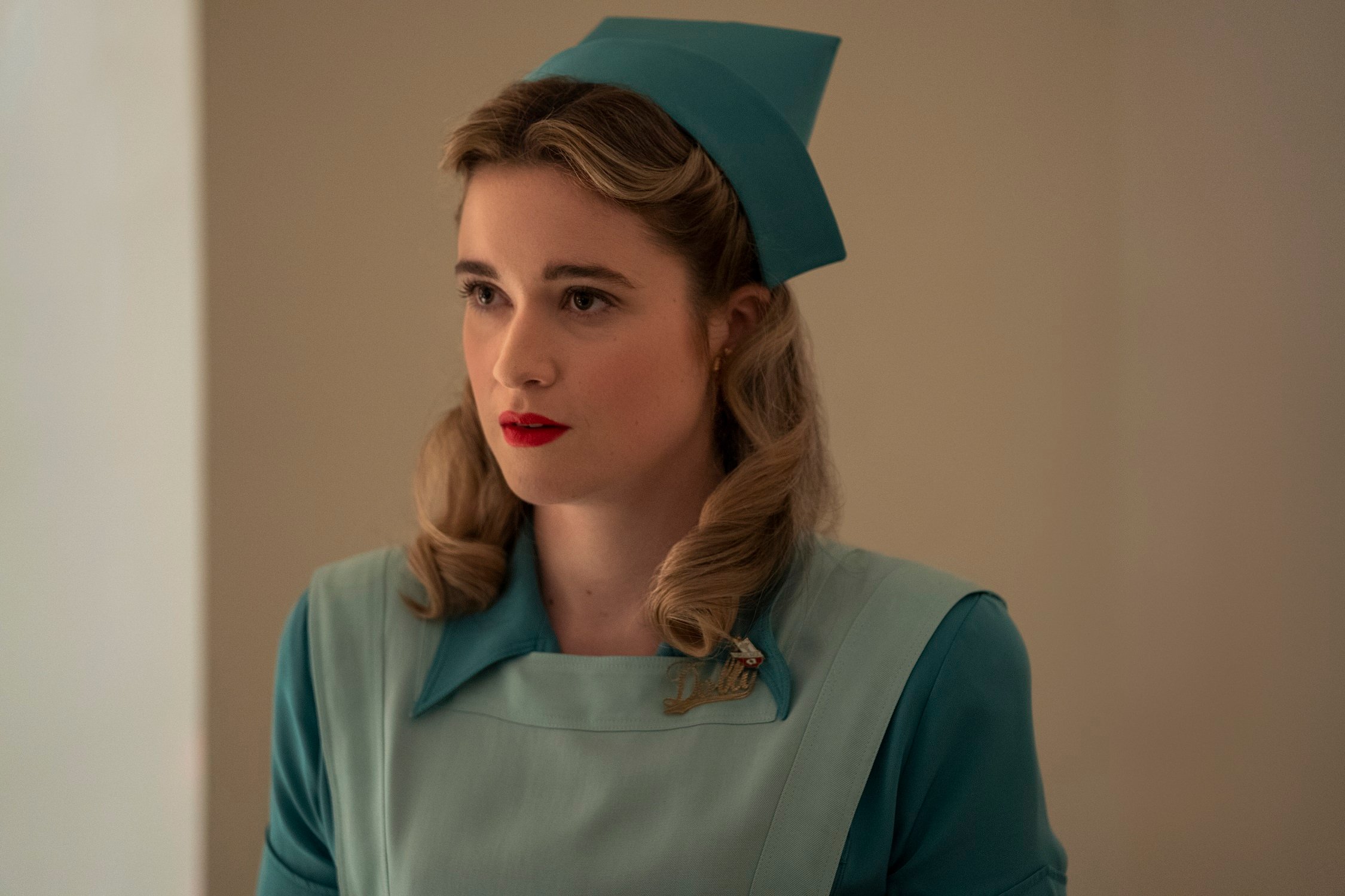 Alice Englert as Nurse Dolly dressed in a nursing uniform during the filming of 'Ratched'