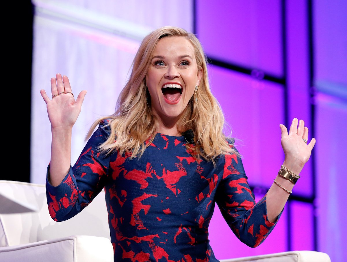 Reese Witherspoon smiling and waving at the camera