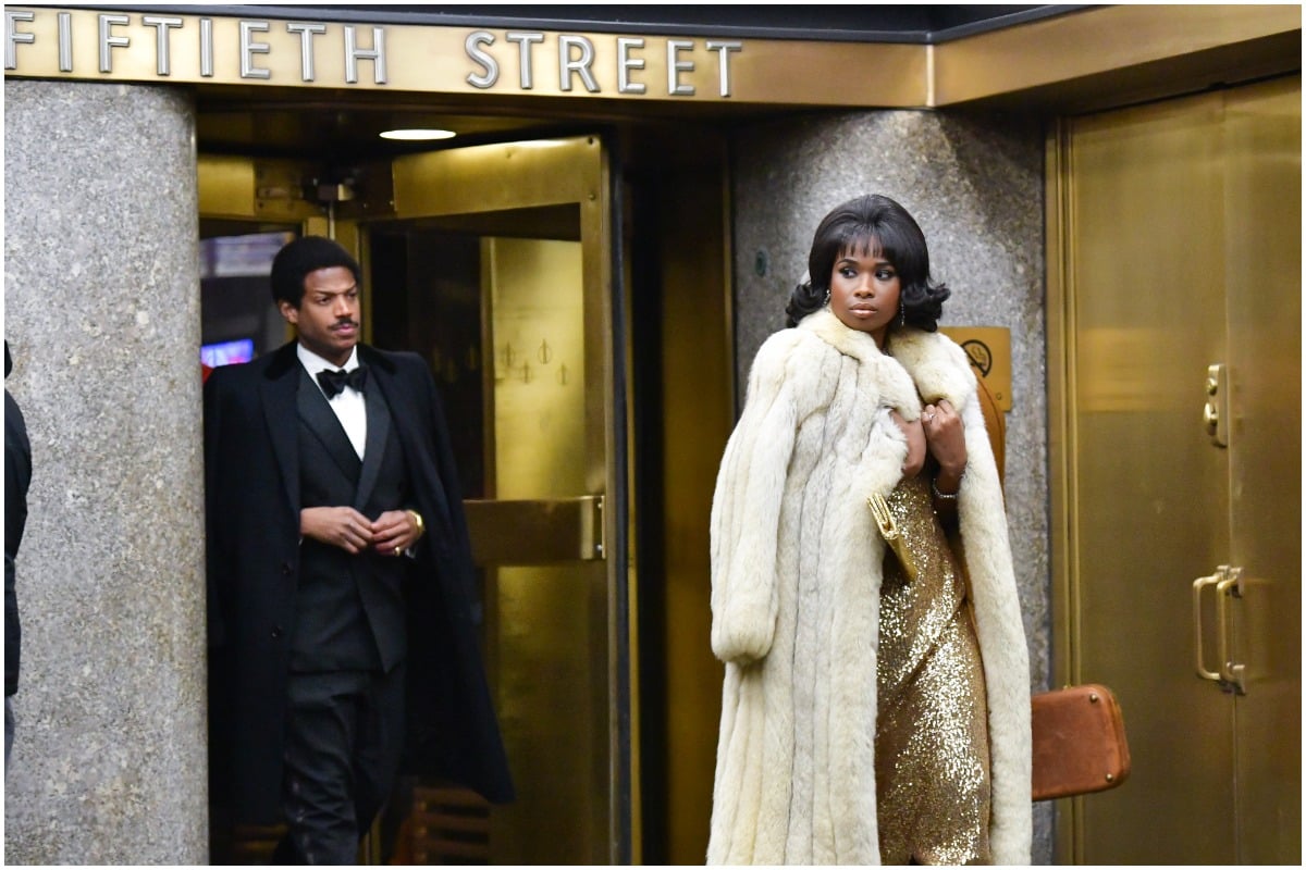 'Respect' stars Jennifer Hudson and Marlon Wayans as Aretha Franklin and Ted White walking out of a building at night.