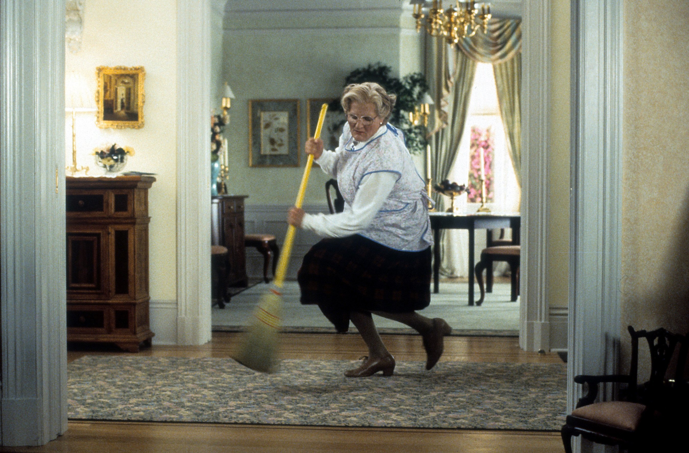 Robin Williams brooms in a scene from the film 'Mrs. Doubtfire'