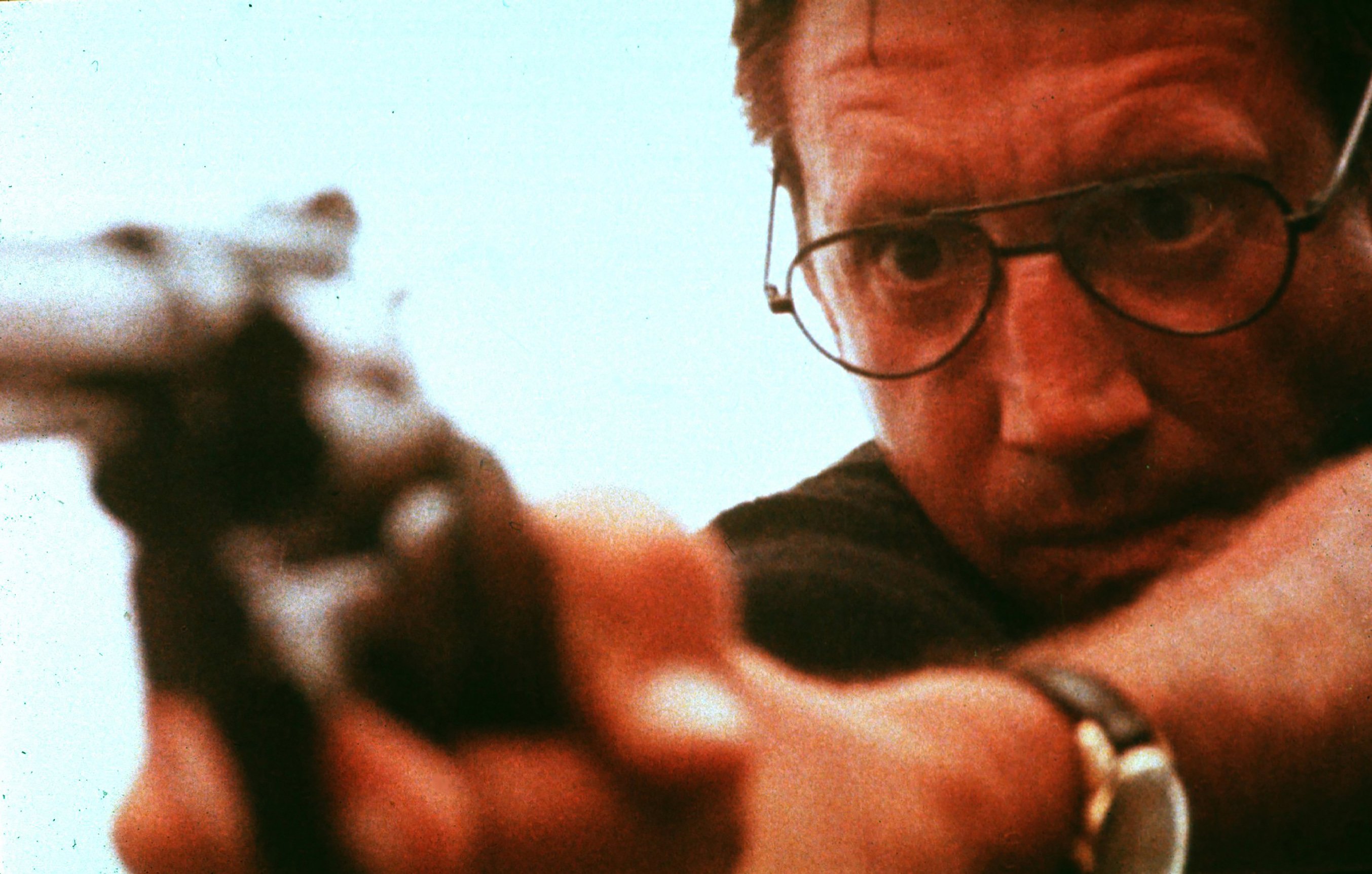 Roy Scheider, as Martin Brody, aims a gun at the shark off screen in one of the final scenes of 'Jaws.'
