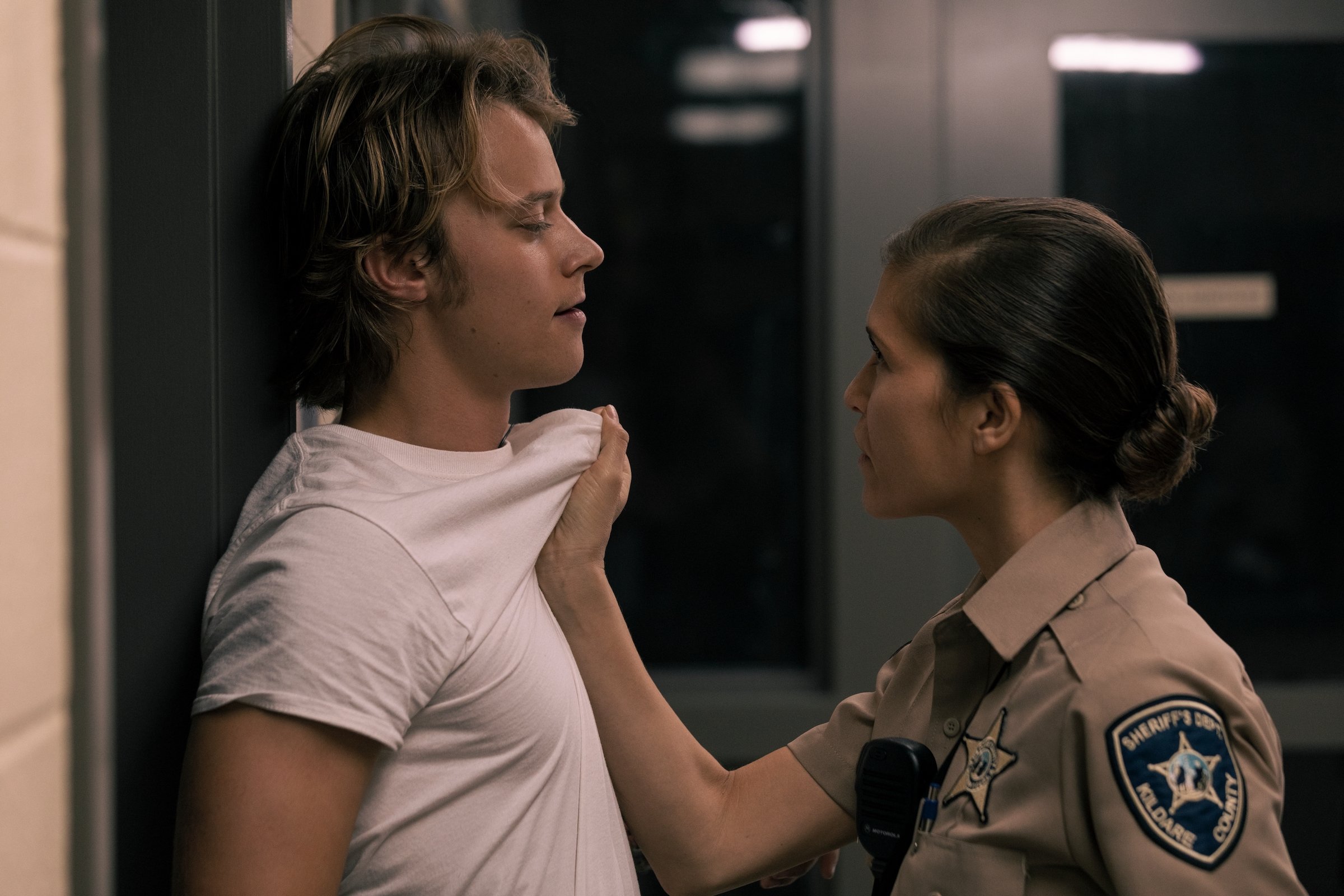 RUDY PANKOW as JJ and CHELLE RAMOS as DEPUTY PLUMB in 'The Darkest Hour' 'Outer Banks' Season 2