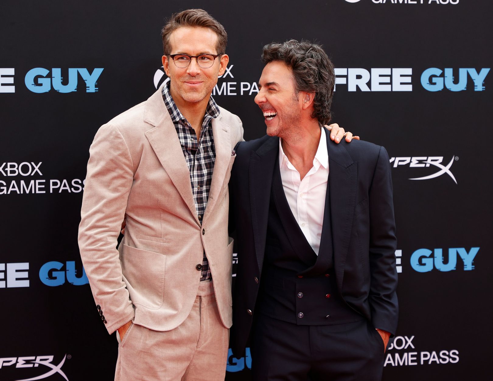 Ryan Reynolds and Shawn Levy 'Free Guy' at movie premiere embracing each other